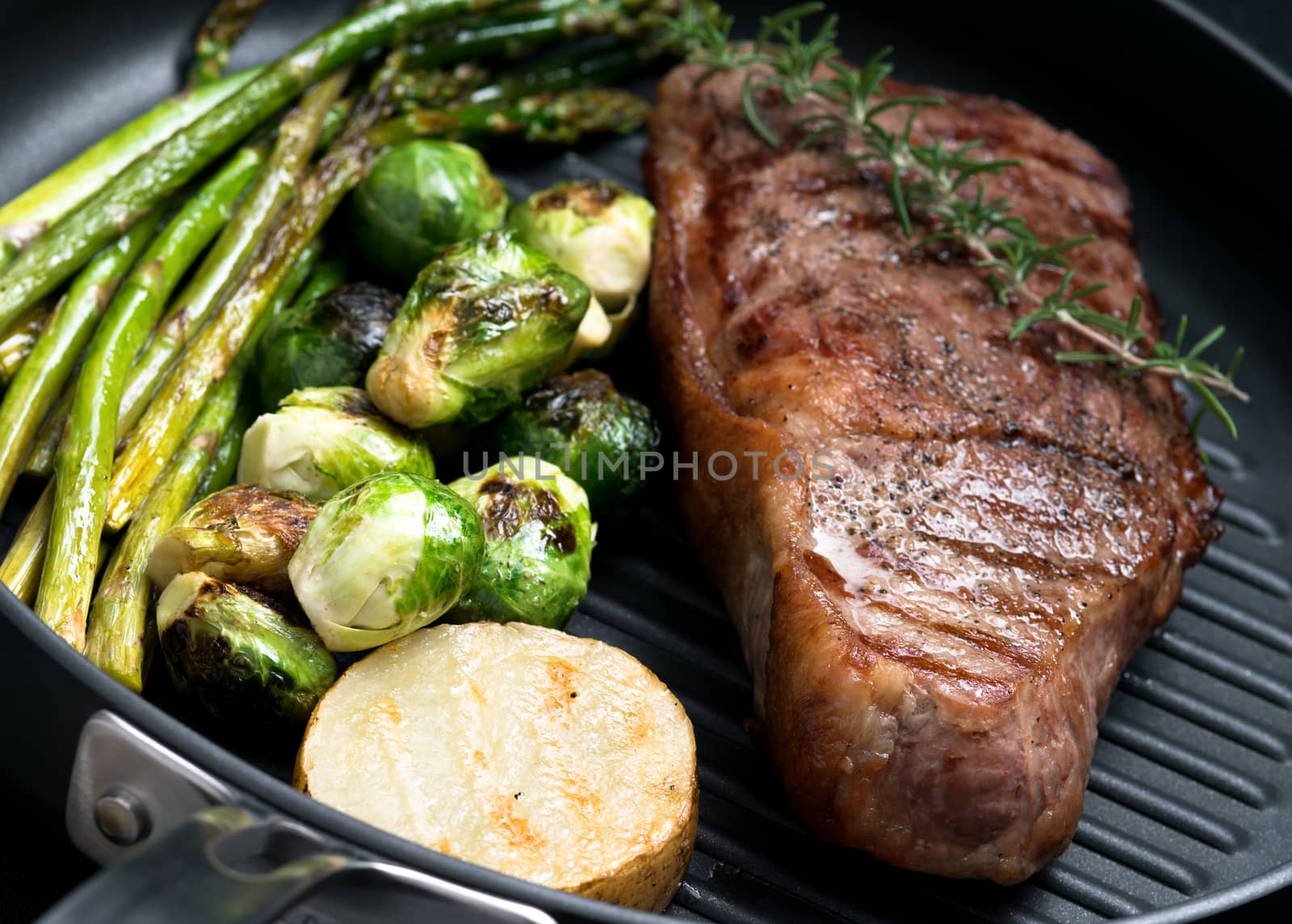 close up view on nice fresh steak on color background