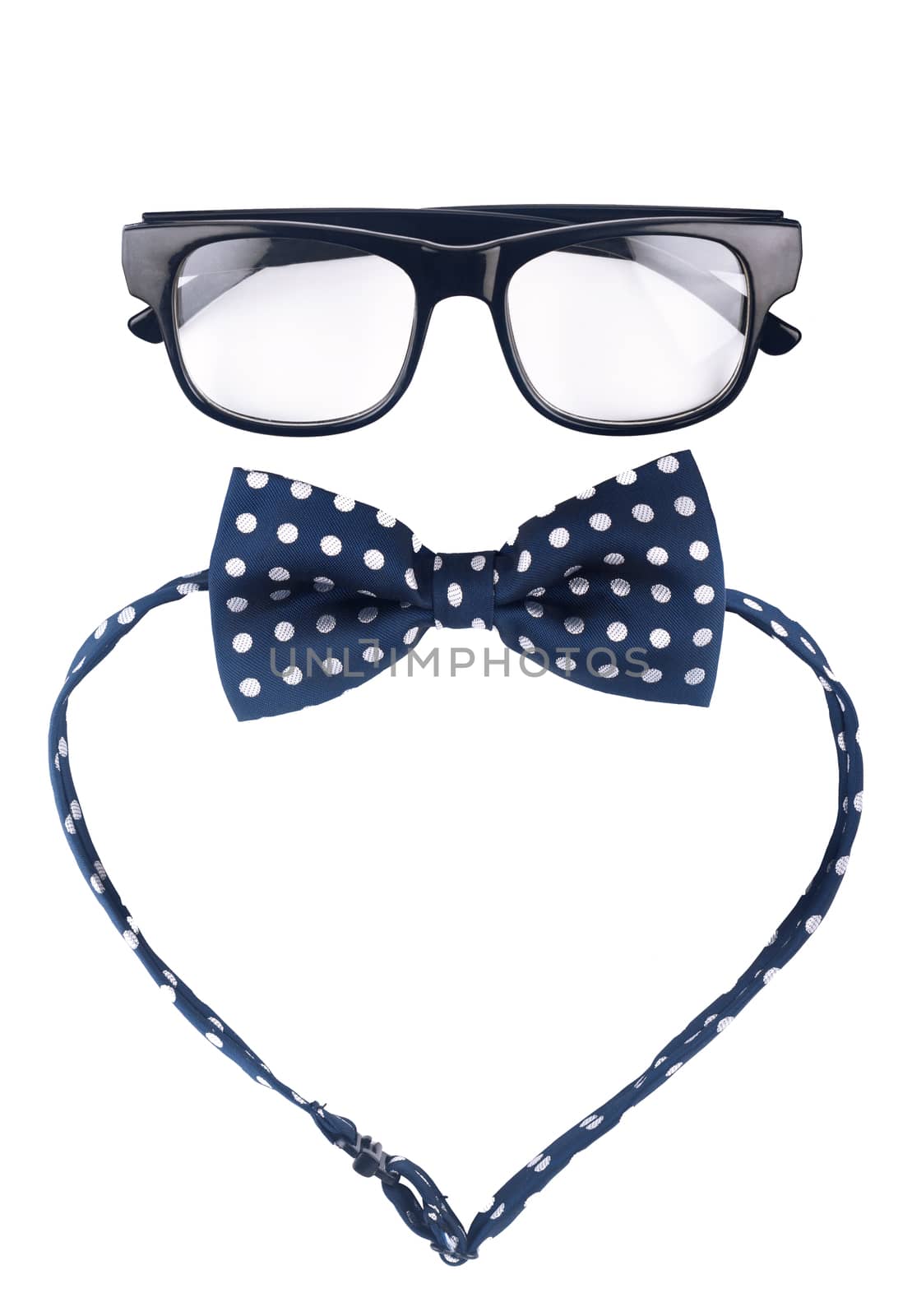 Hipster glasses and dotted bow isolated on white background
