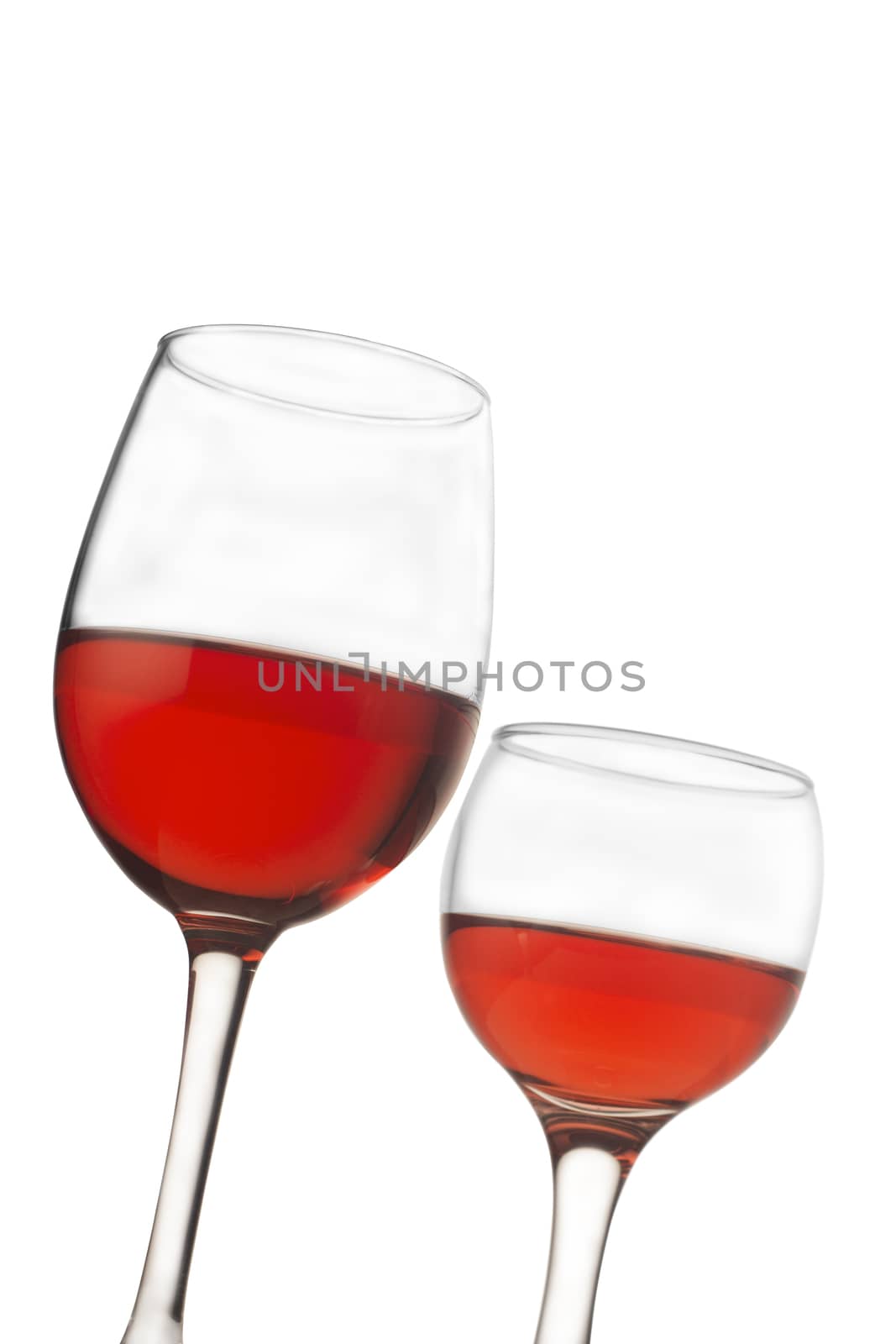 Vertical front view of two rose wine glasses isolated on white background