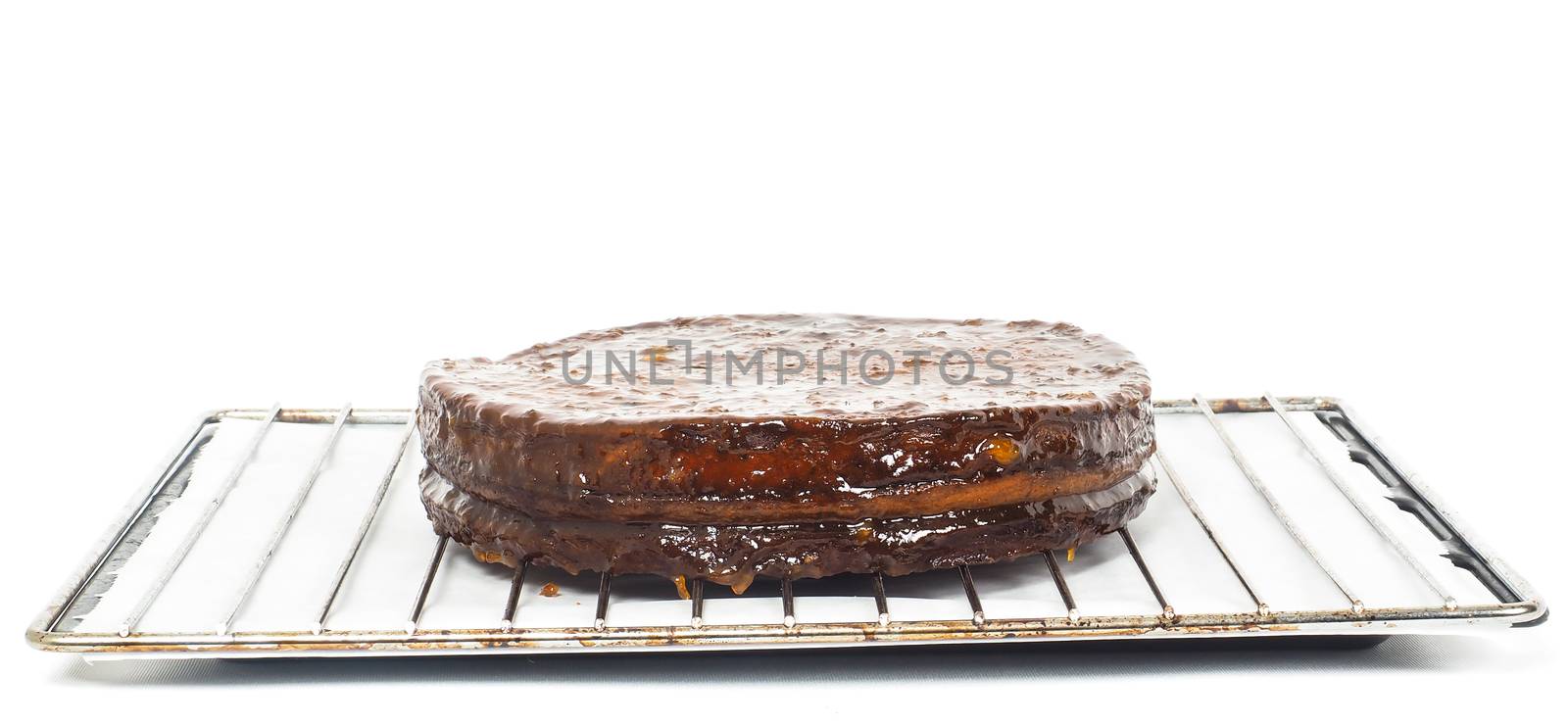 Half stage on sacher torte chocolate cake on grid before chocola by Arvebettum