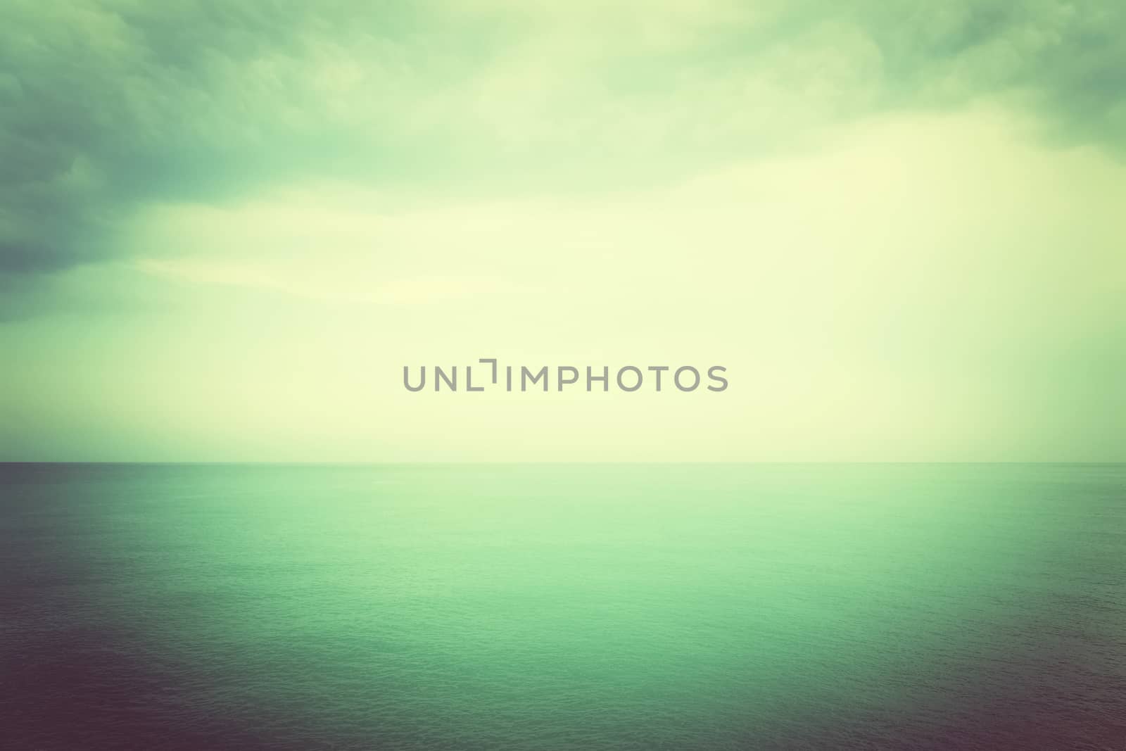 Calm sea in mystical green glow. Mediterranean nature. Retro style image.