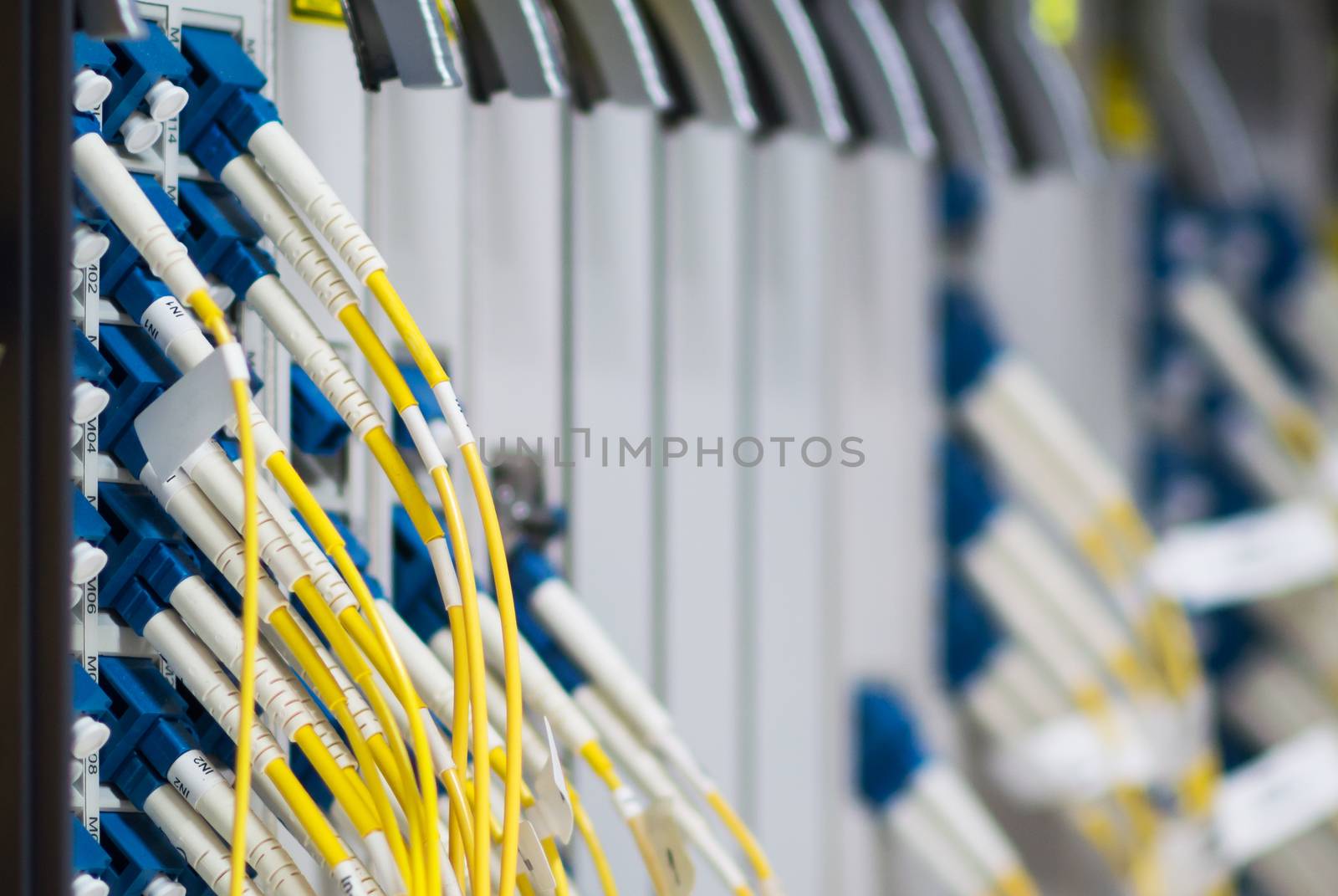 fiber optic with servers in a technology data center .