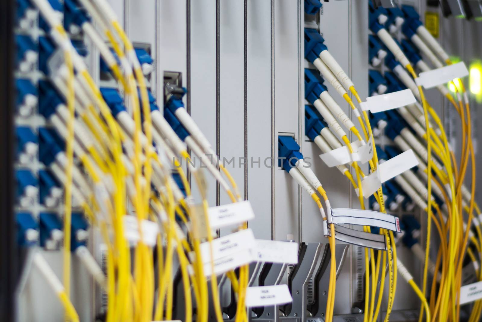 fiber optic with servers in a technology data center .