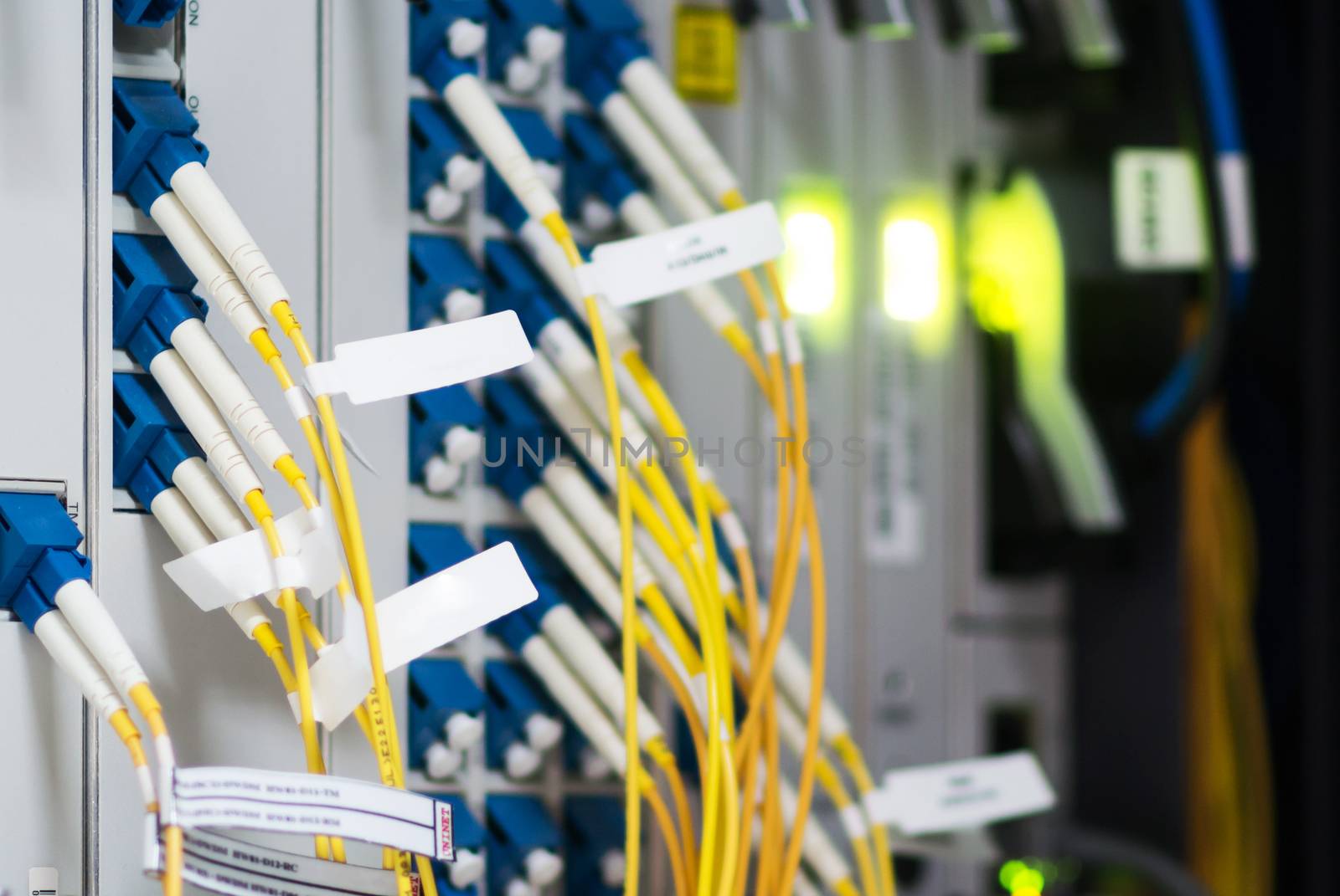 fiber optic with servers in a technology data center .