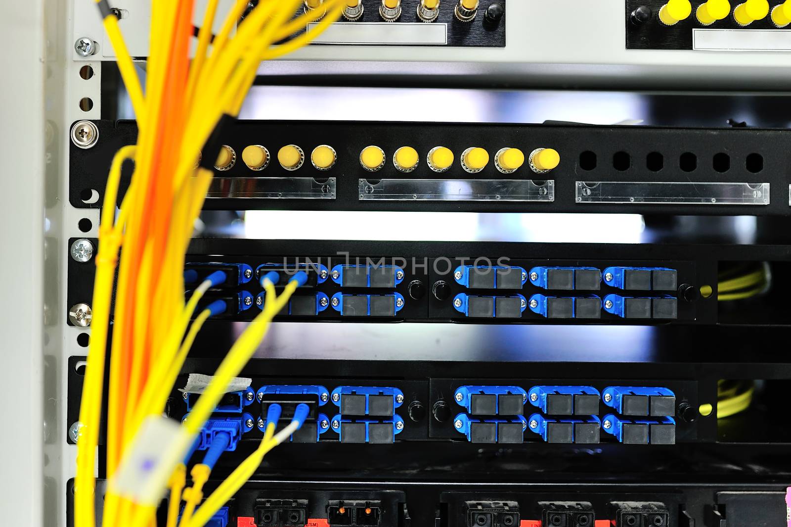 fiber optic with servers in a technology data center .