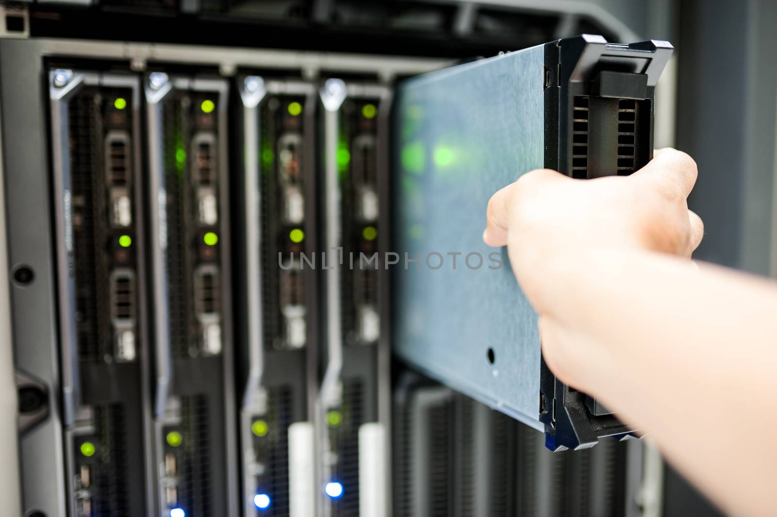 Man fix server network in data center room .