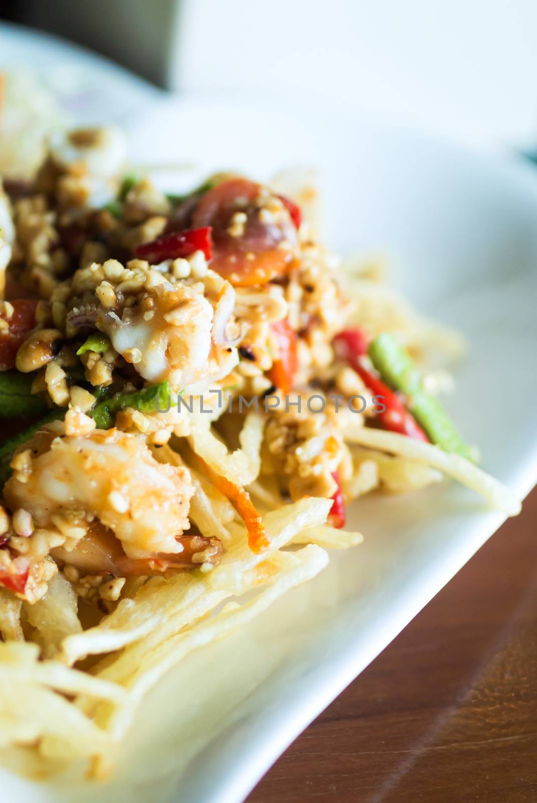 papaya salad with horse crab close up .