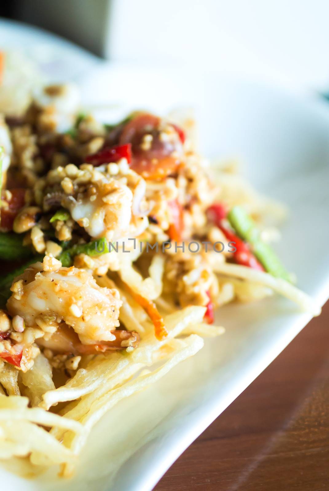 papaya salad with horse crab close up .