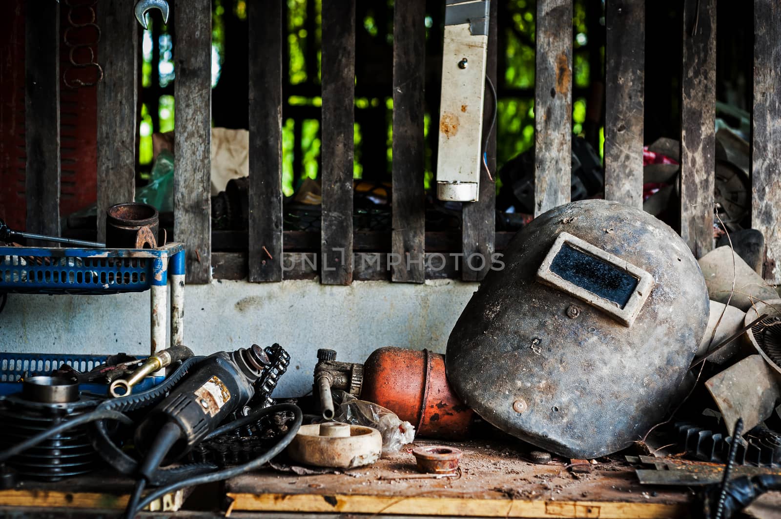 Welding helmet still life in equipment room by panumazz@gmail.com