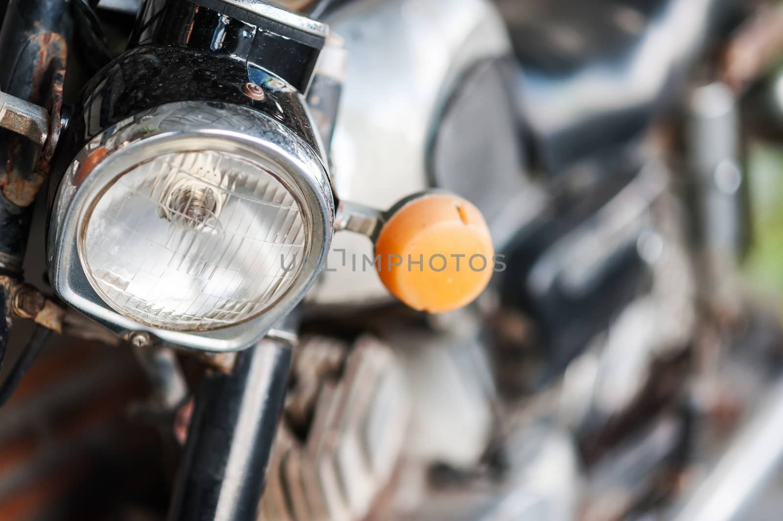 An Old motorcycle in vintage place .