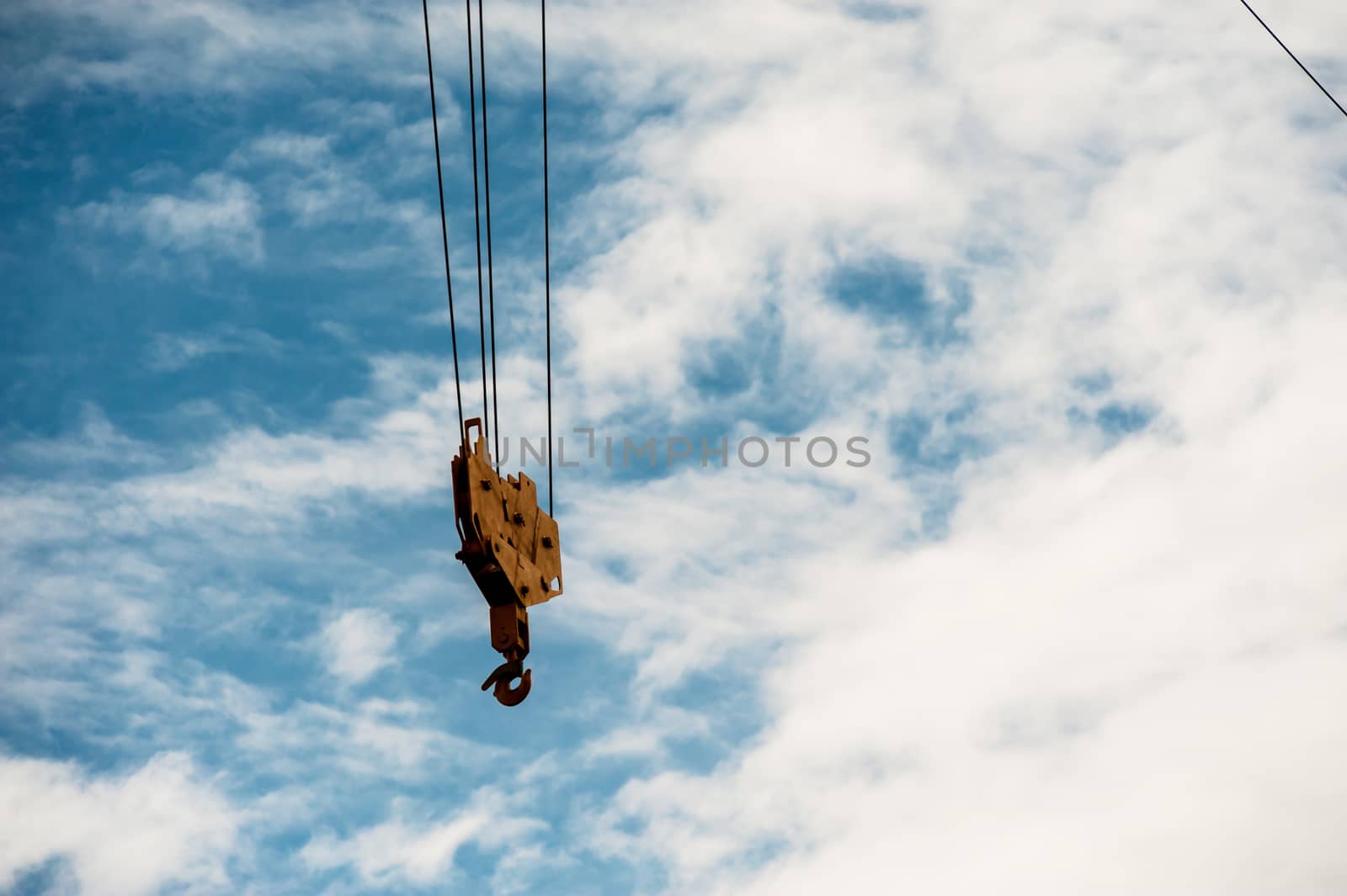 Crane in construction with blue sky by panumazz@gmail.com