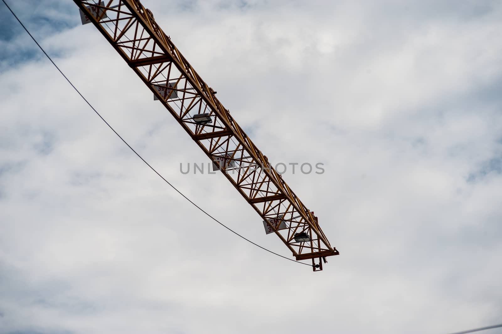 Crane in construction with blue sky by panumazz@gmail.com