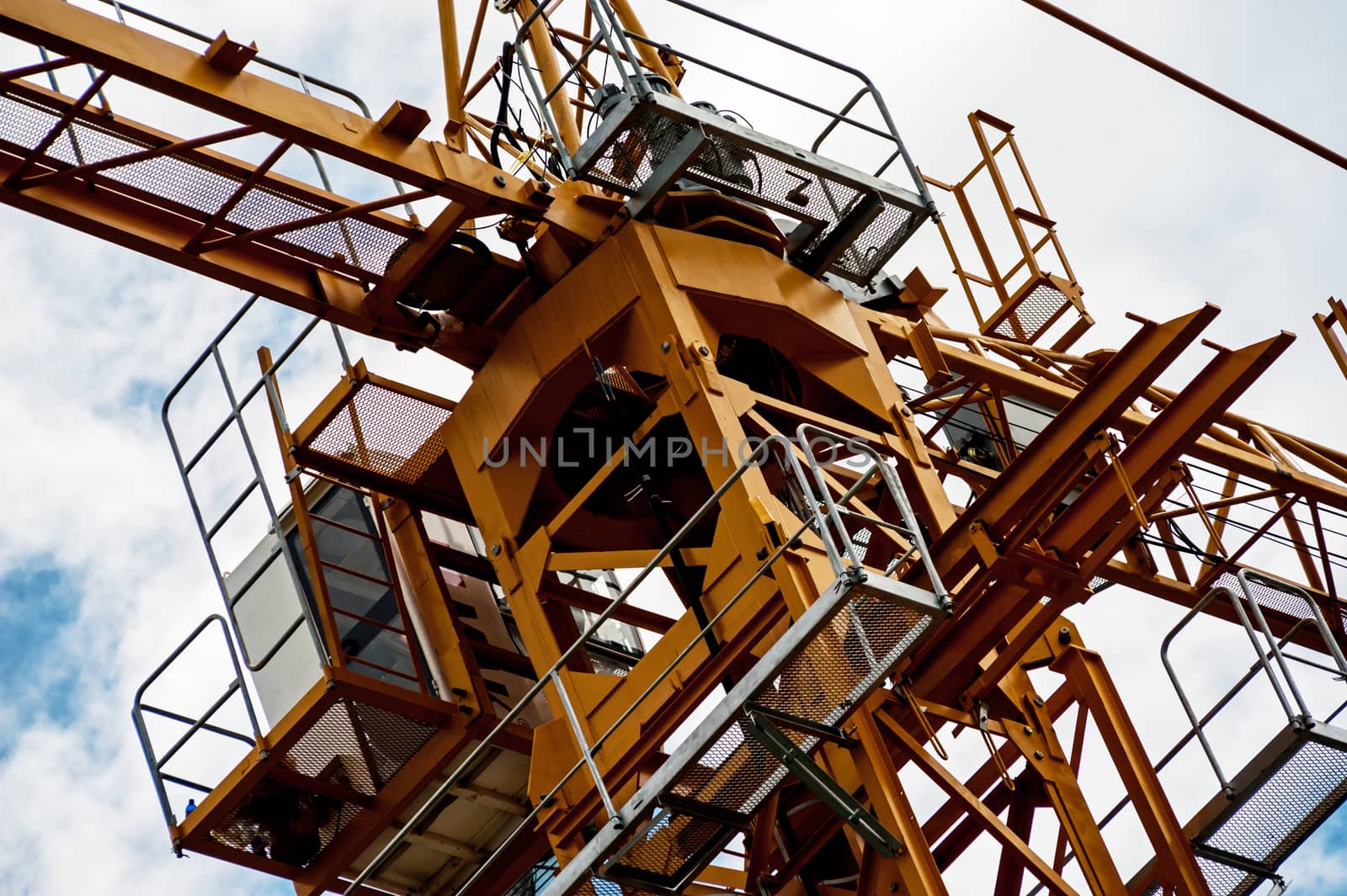 An Crane in construction with blue sky .