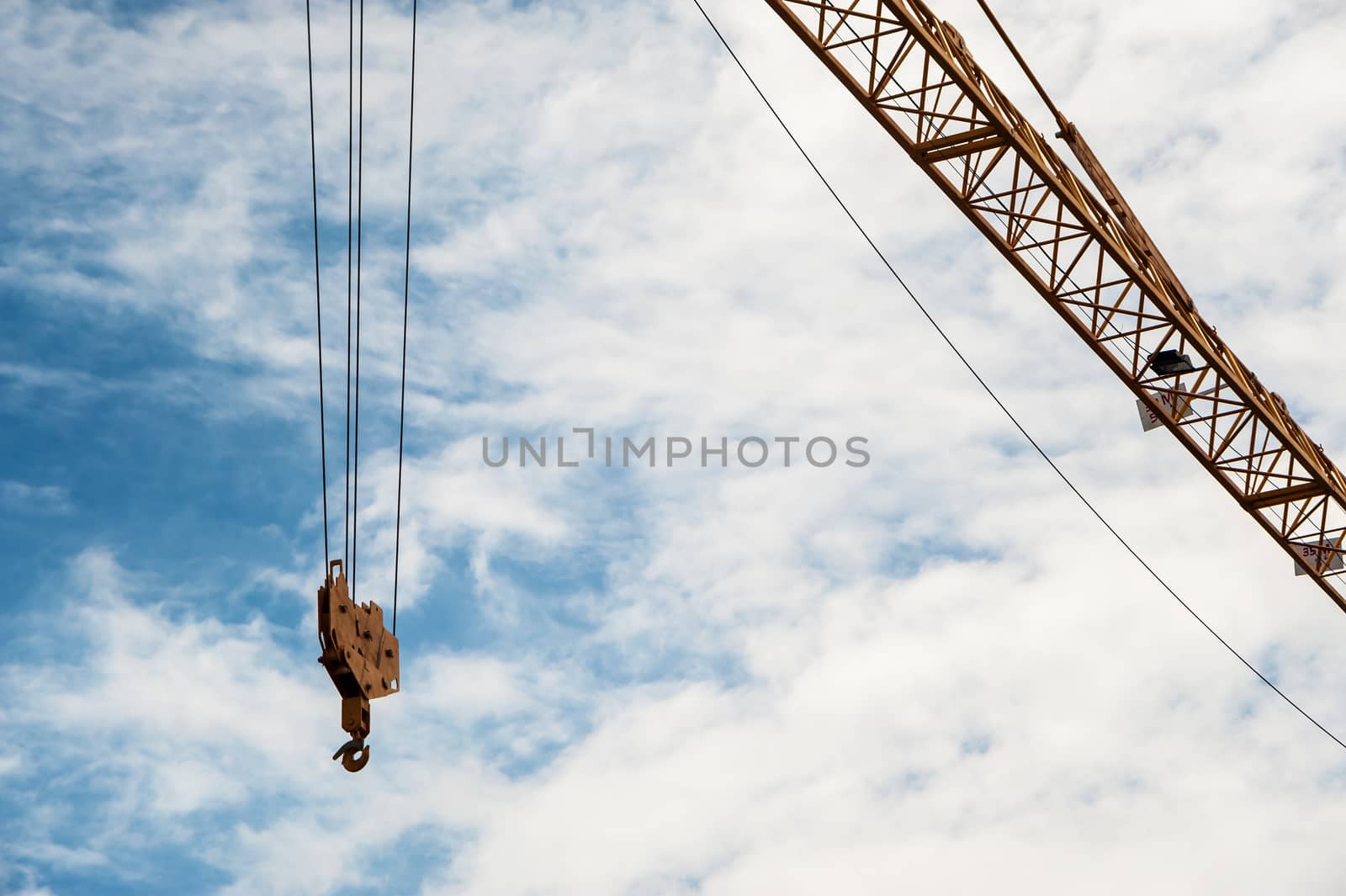 Crane in construction with blue sky by panumazz@gmail.com