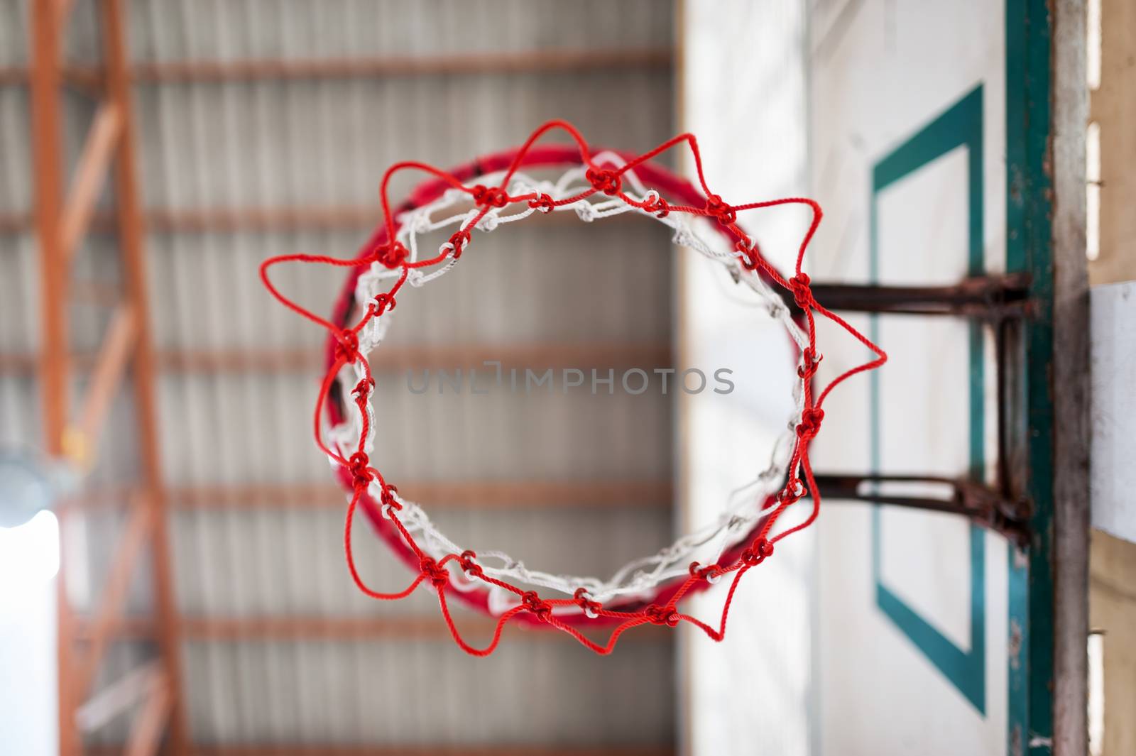 An Basketball hoop indoor sport .