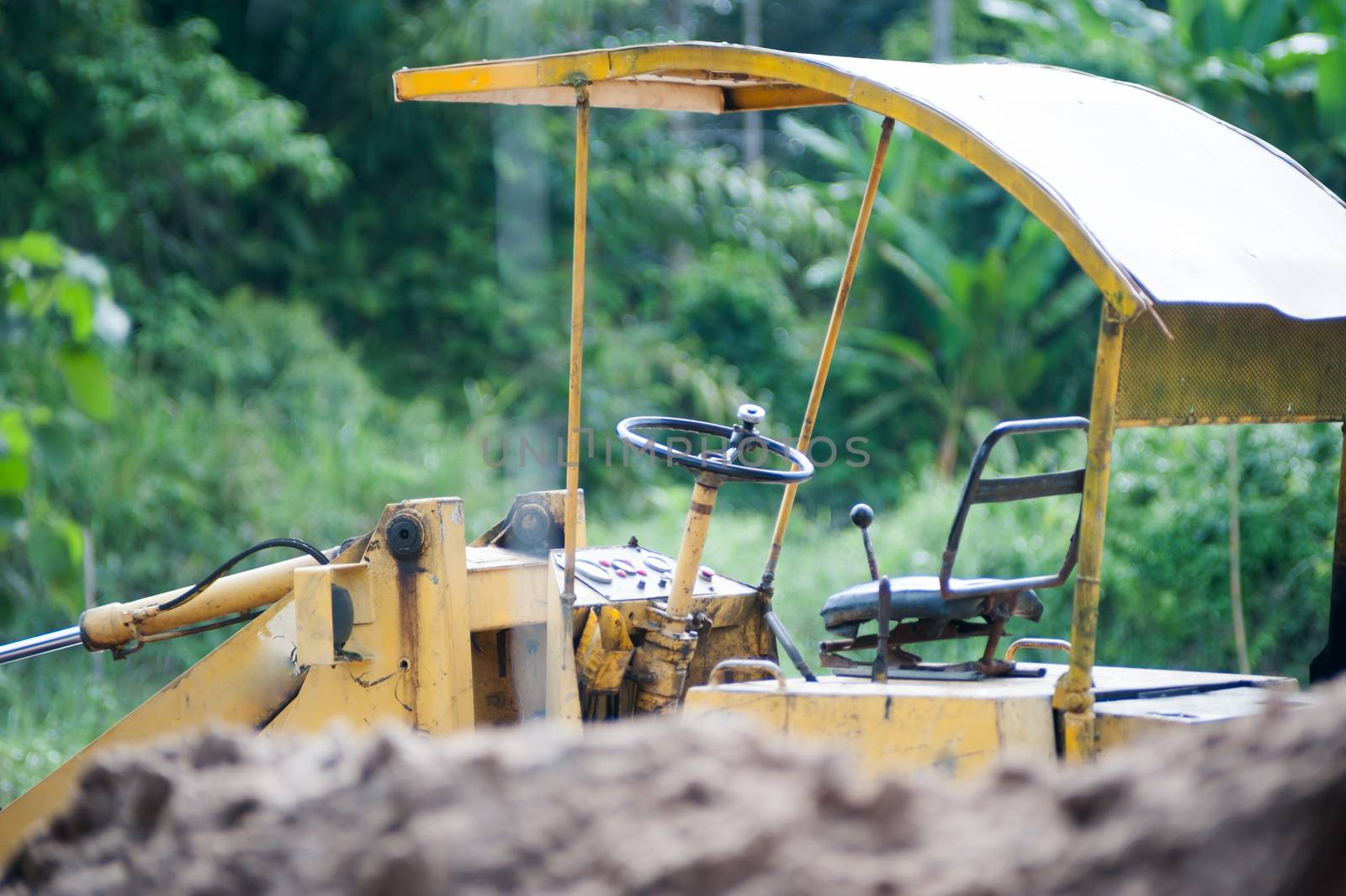 excavator on a construction site by panumazz@gmail.com