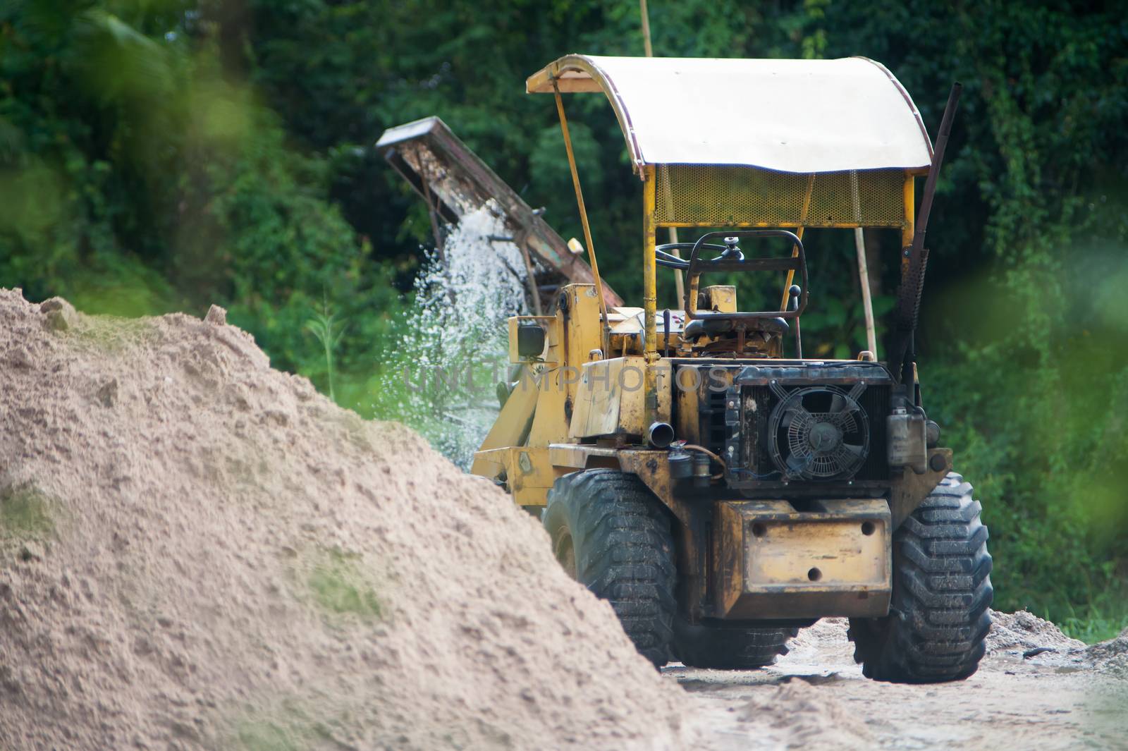 An excavator on a construction site .