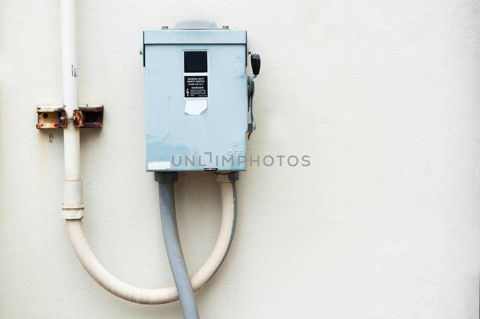 Electric outdoor fuse box in soft light .