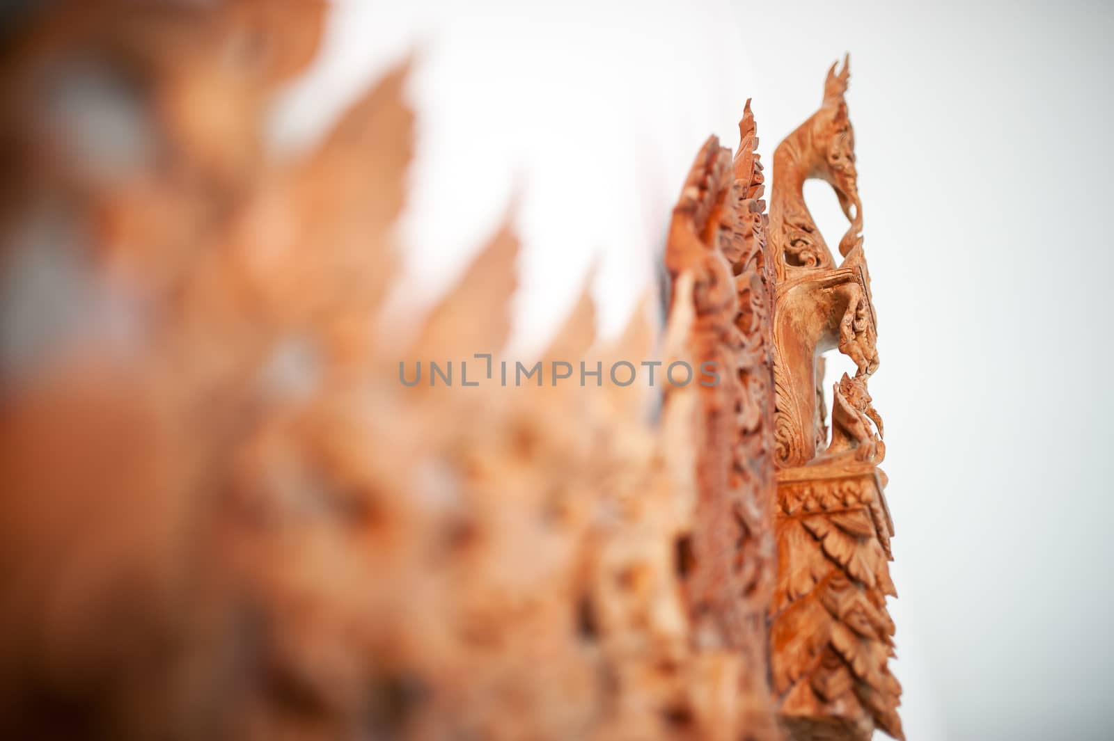 Carved flower line thai with soft light .