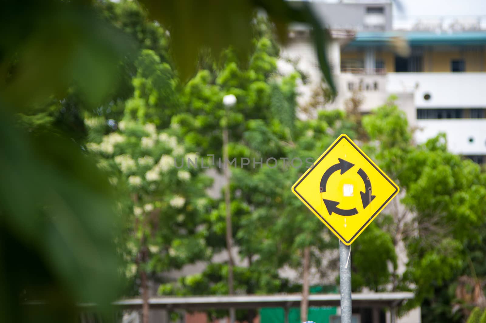 An roundabout  sign in soft light .