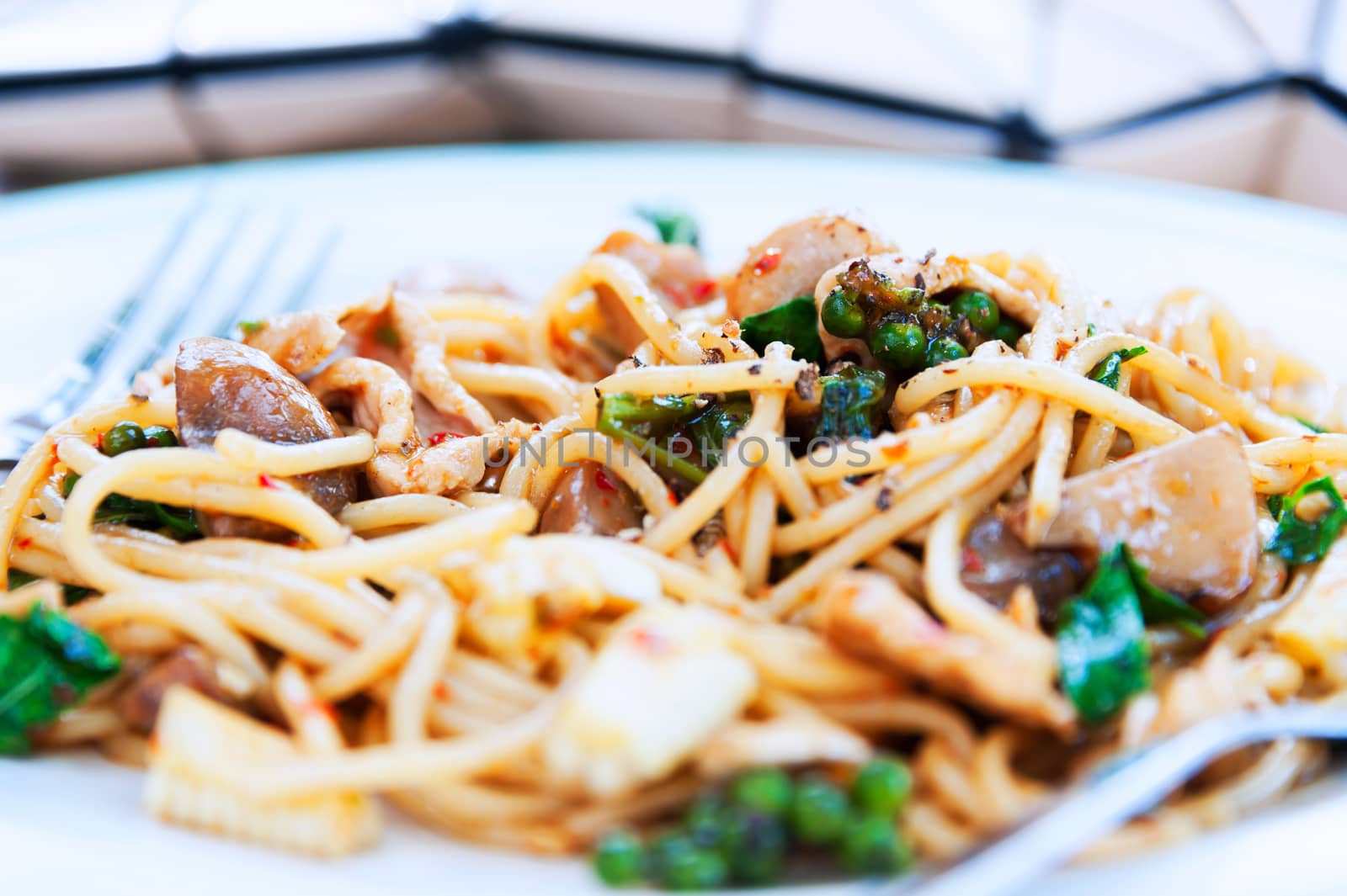 spaghetti in white disk with soft light .