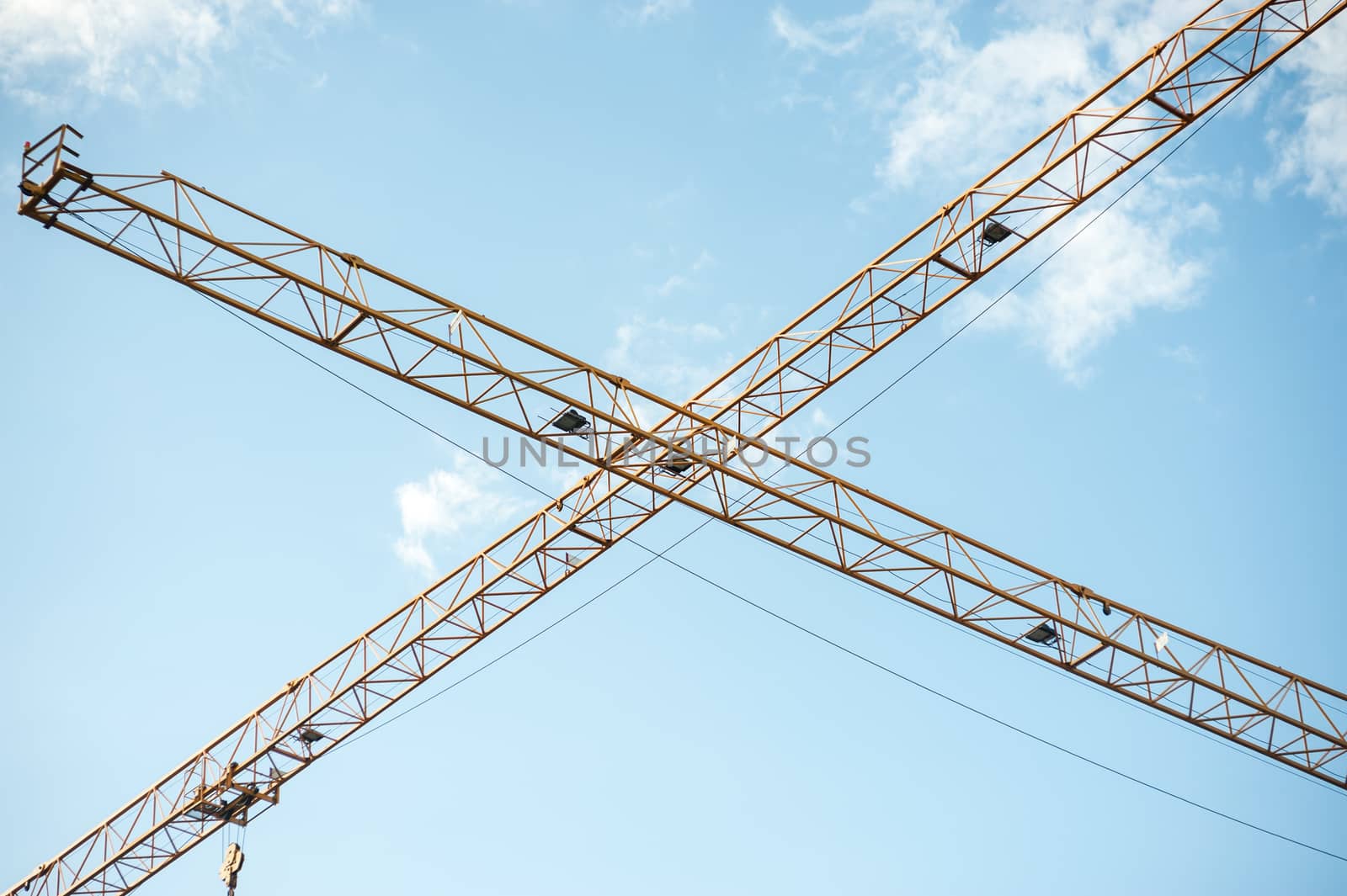 An Crane in construction with blue sky .