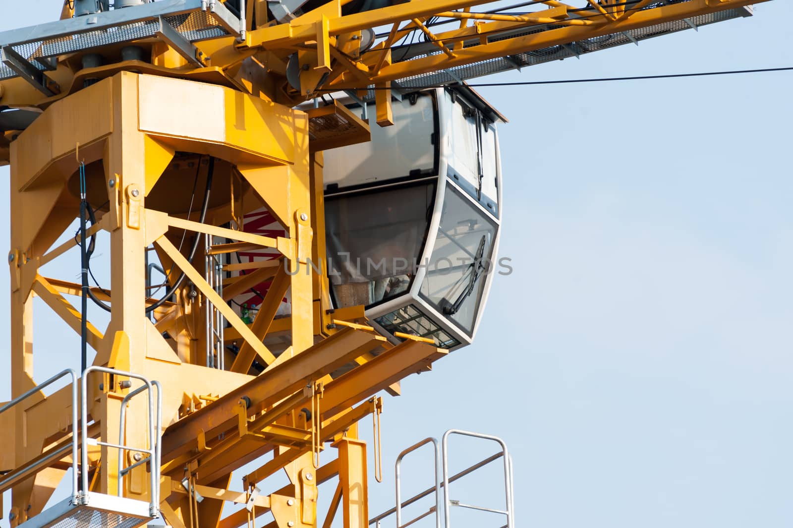 Crane in construction with blue sky by panumazz@gmail.com