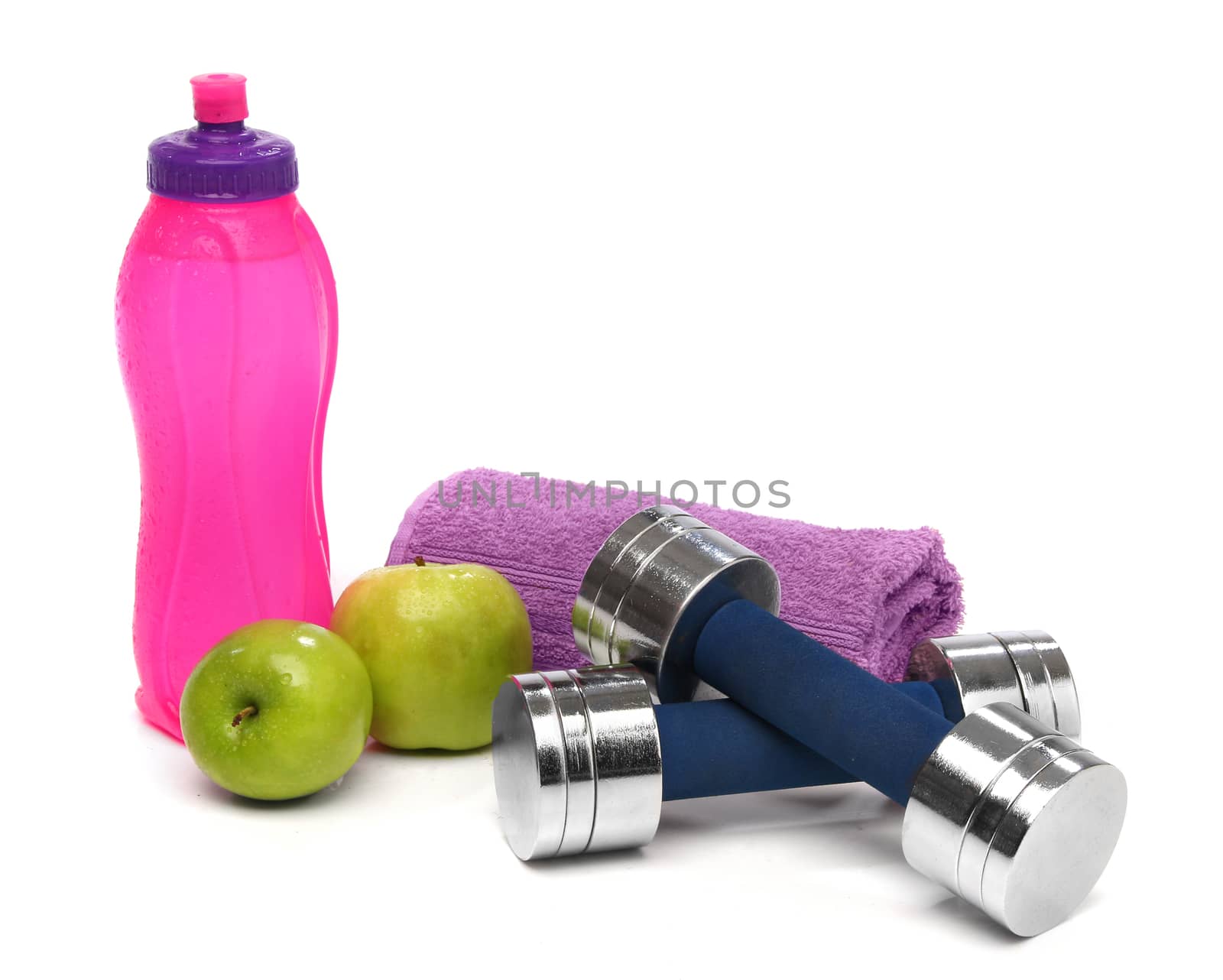 Fitness concept with a bottle of water, a towel, dumbbells and apples by Erdosain