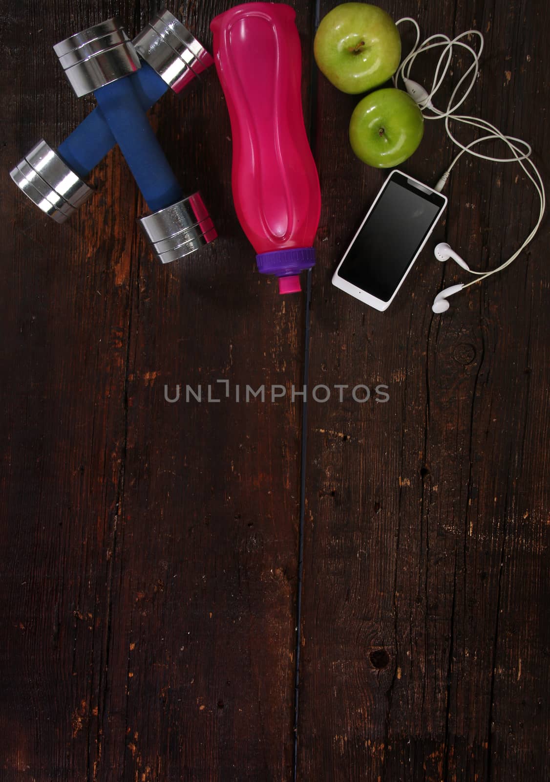 Fitness concept. Elements over a wooden background by Erdosain