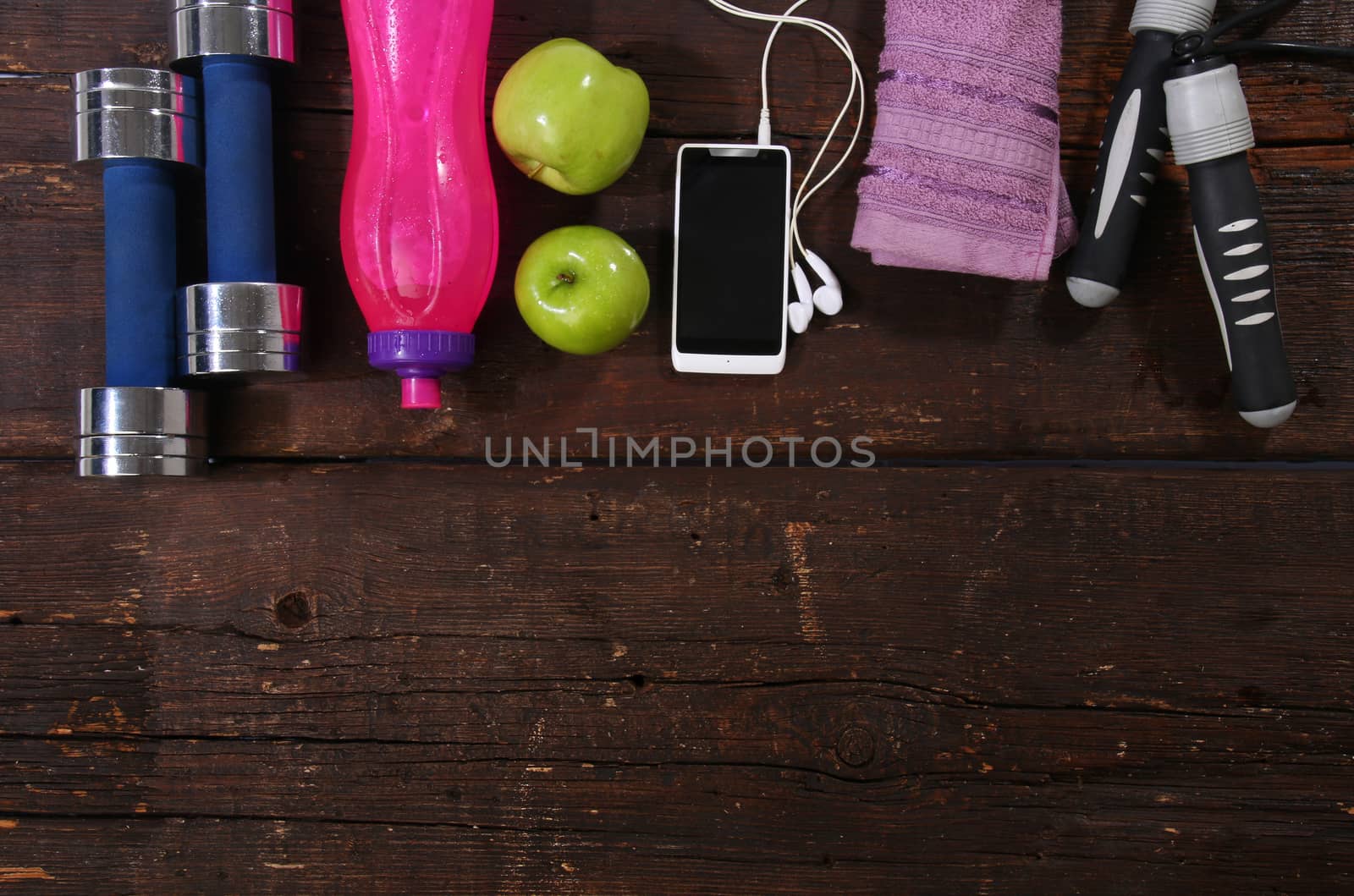 Fitness concept. Various elements over a wooden background