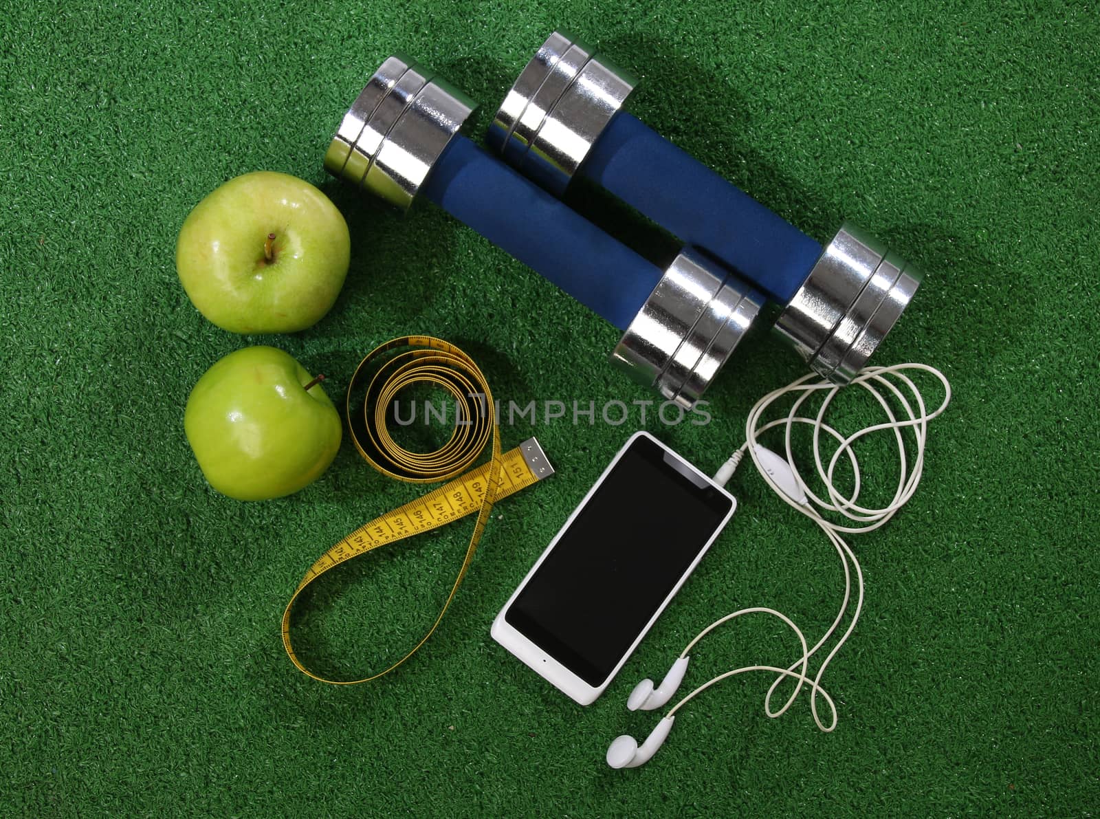 Fitness concept. Various elements over a grass background