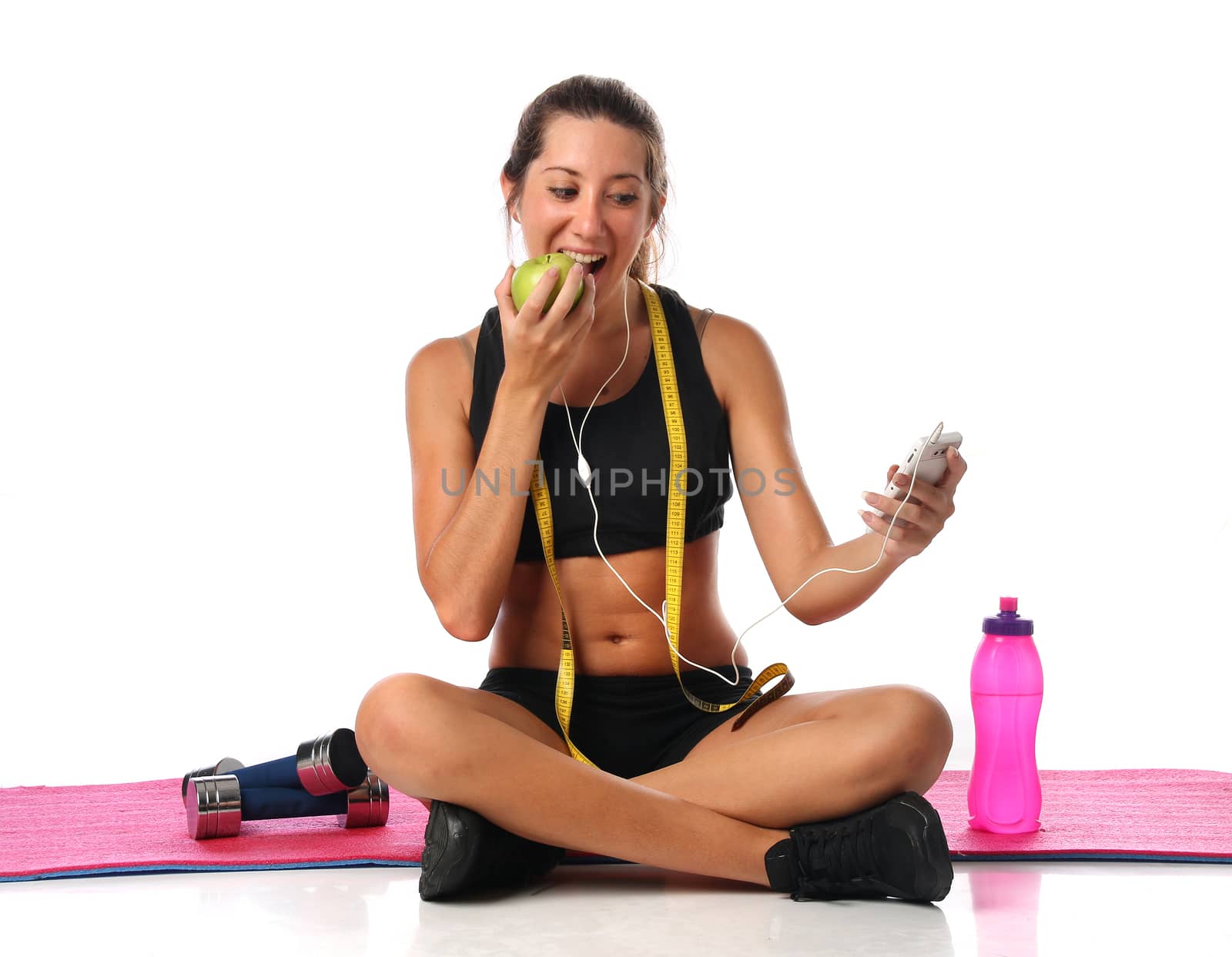 Happy young woman with her fitness equipment over white