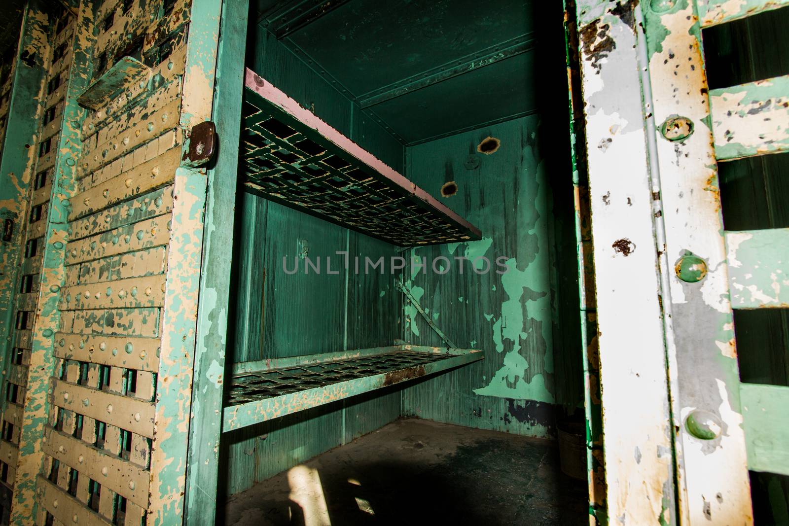 Prison cells lit by a high contrast harsh light