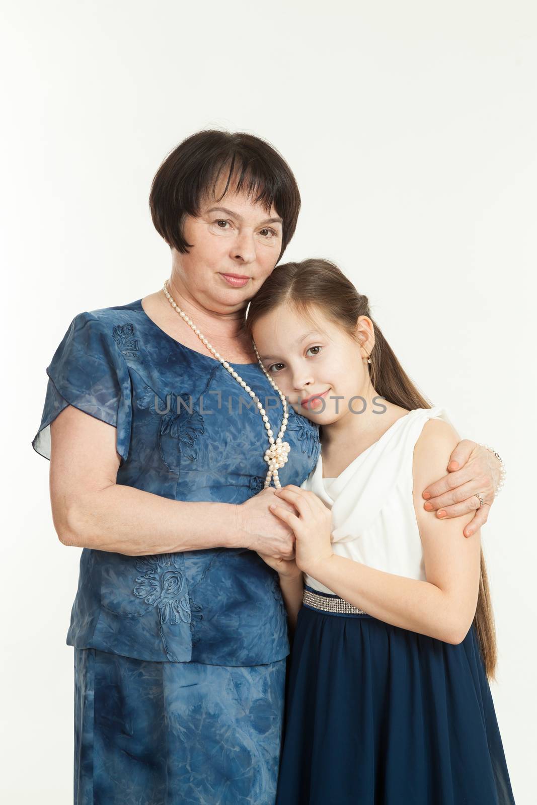 the grandmother and the granddaughter stand  by sveter