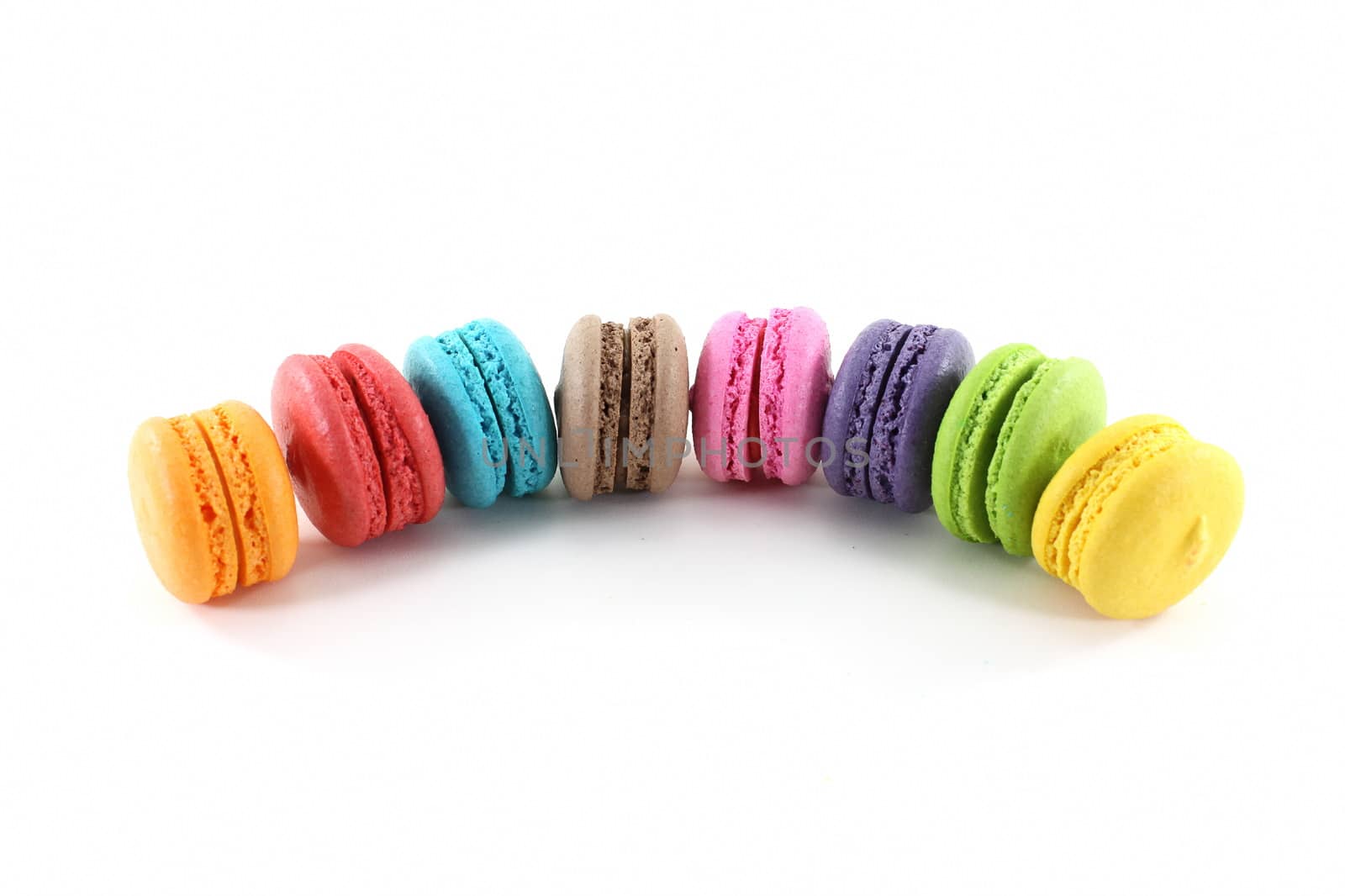 Sweet color macaroons isolate on white background by worrayuth