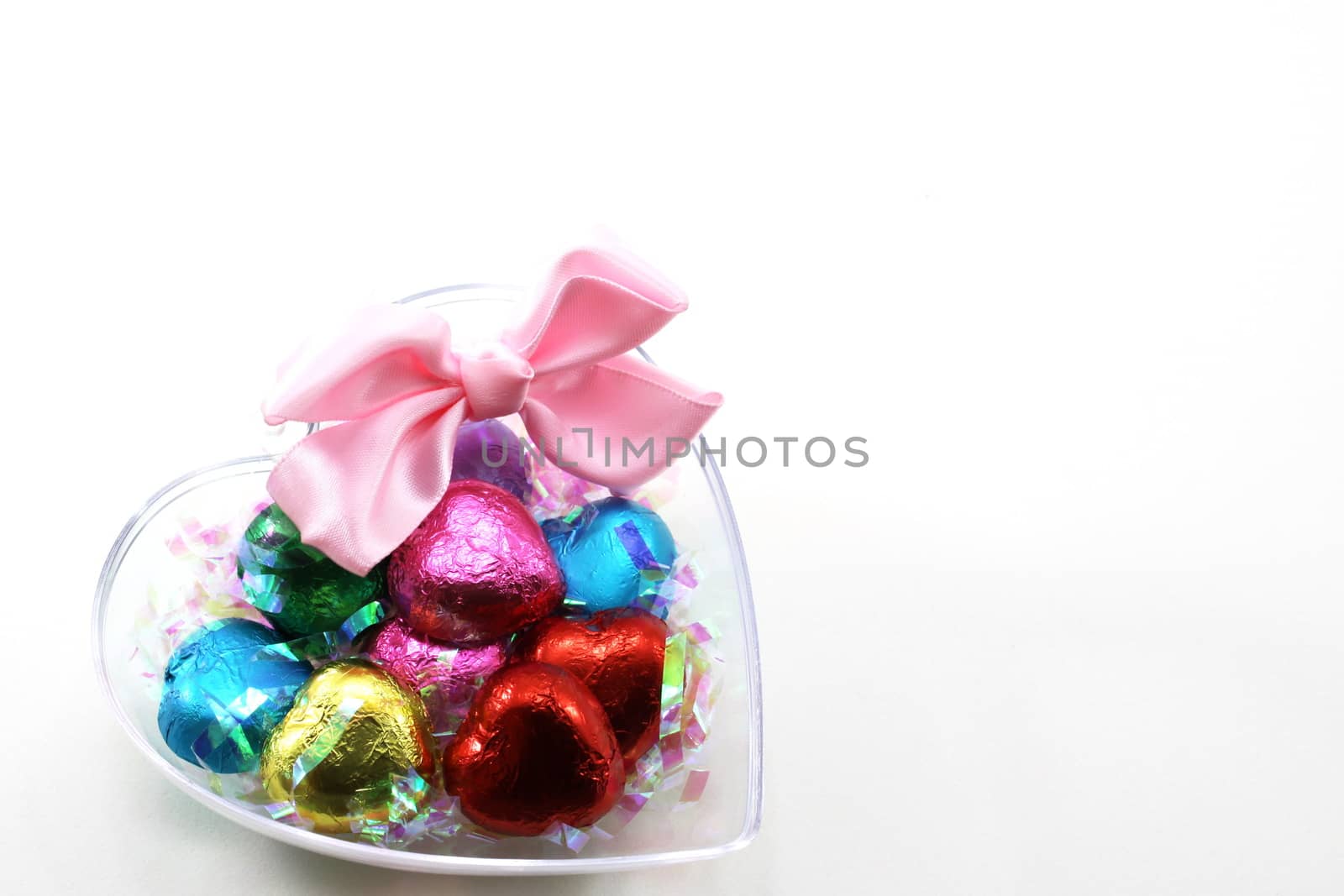 Chocolate hearts candies on white background