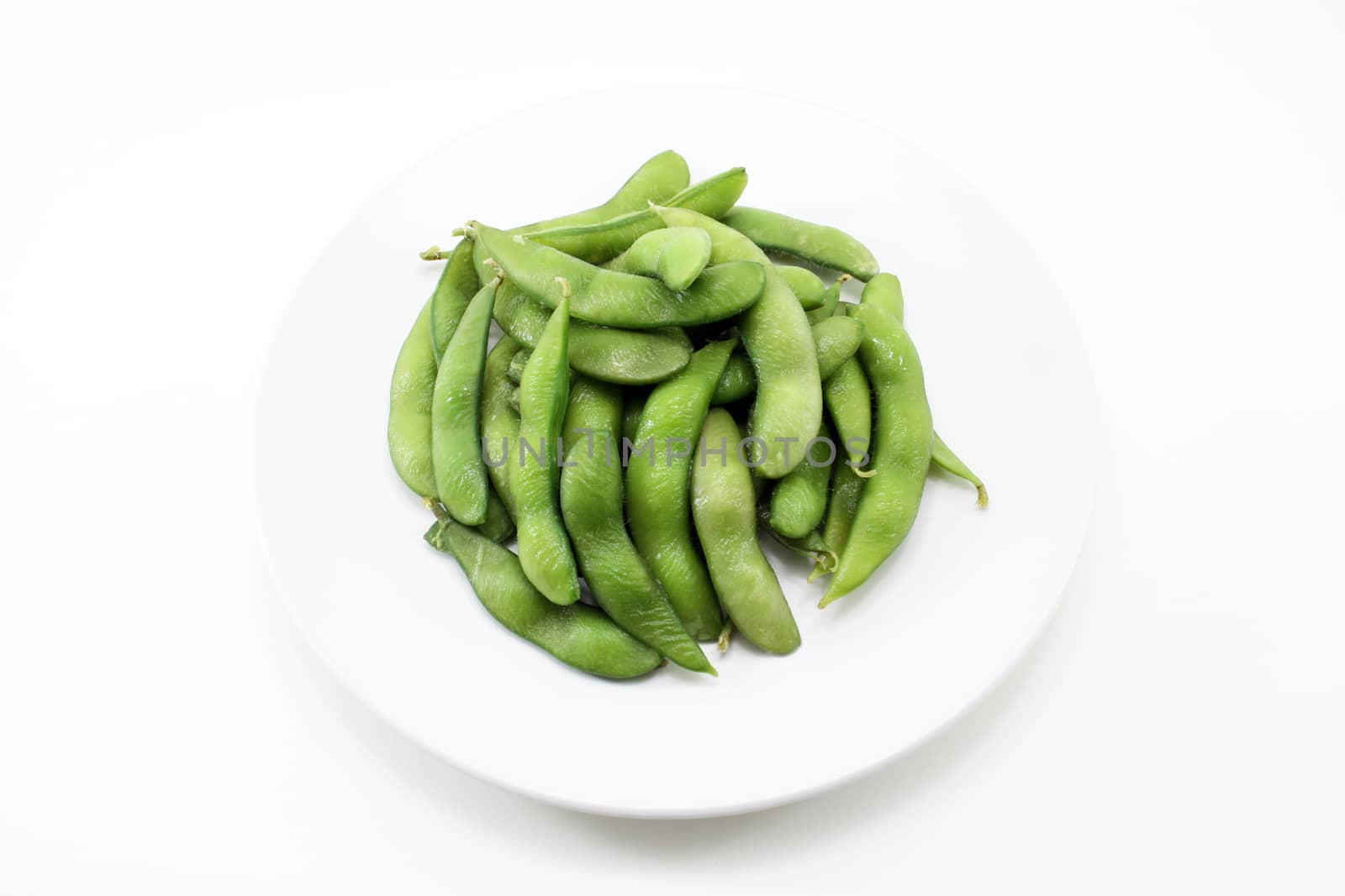 Close green soybeans on white background fresh