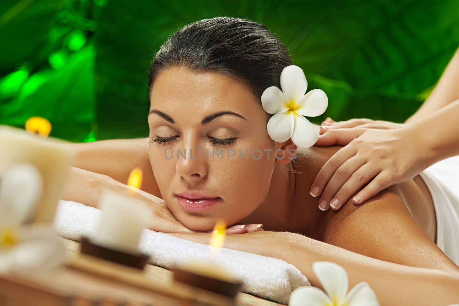 portrait of young beautiful woman in spa environment.