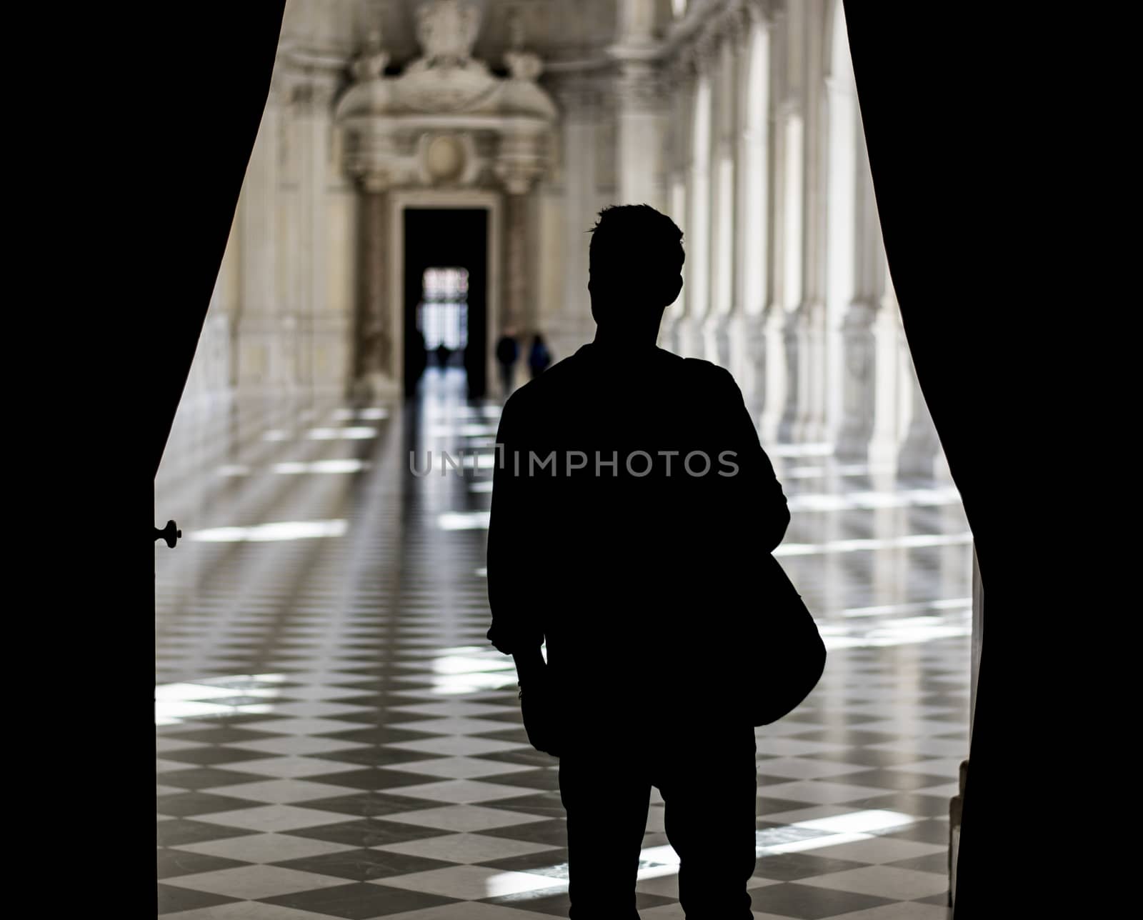 Handsome Man Holding a Guide Inside a Museum by artofphoto