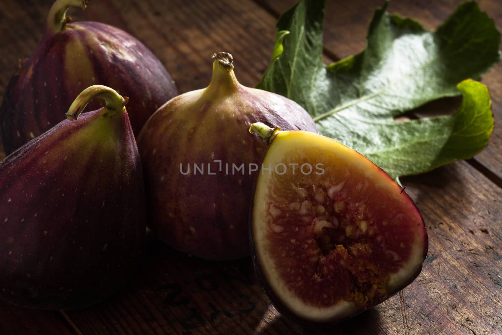 close up view of fresh figs on color back