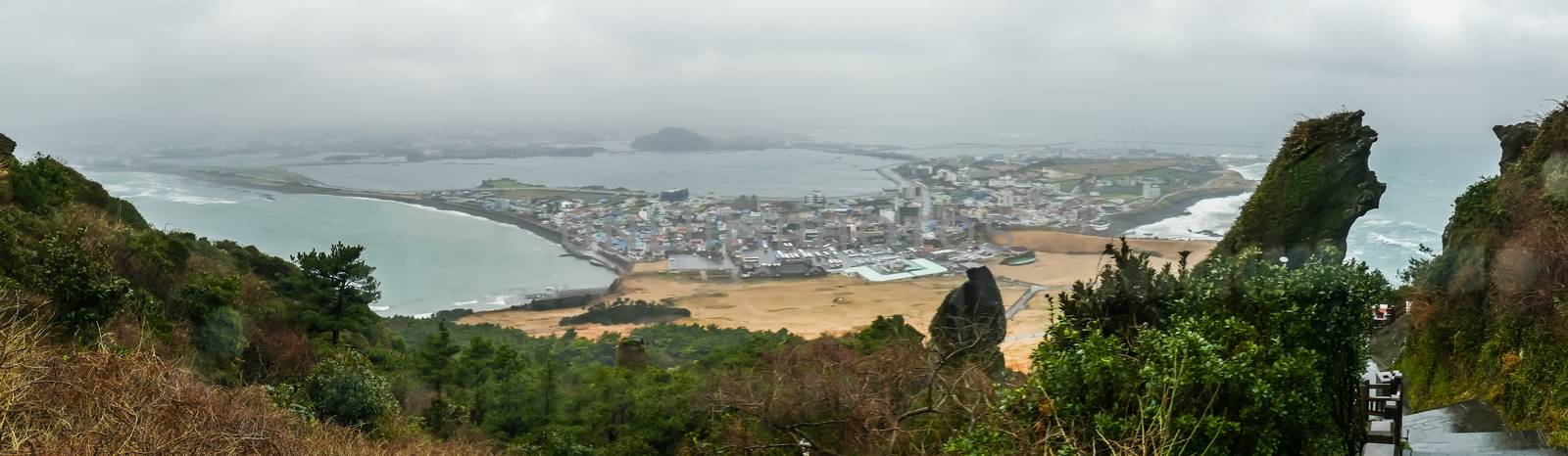 Panorama of Seongsan Ilchulbong volcano in rainny, South Korea. by chatchai