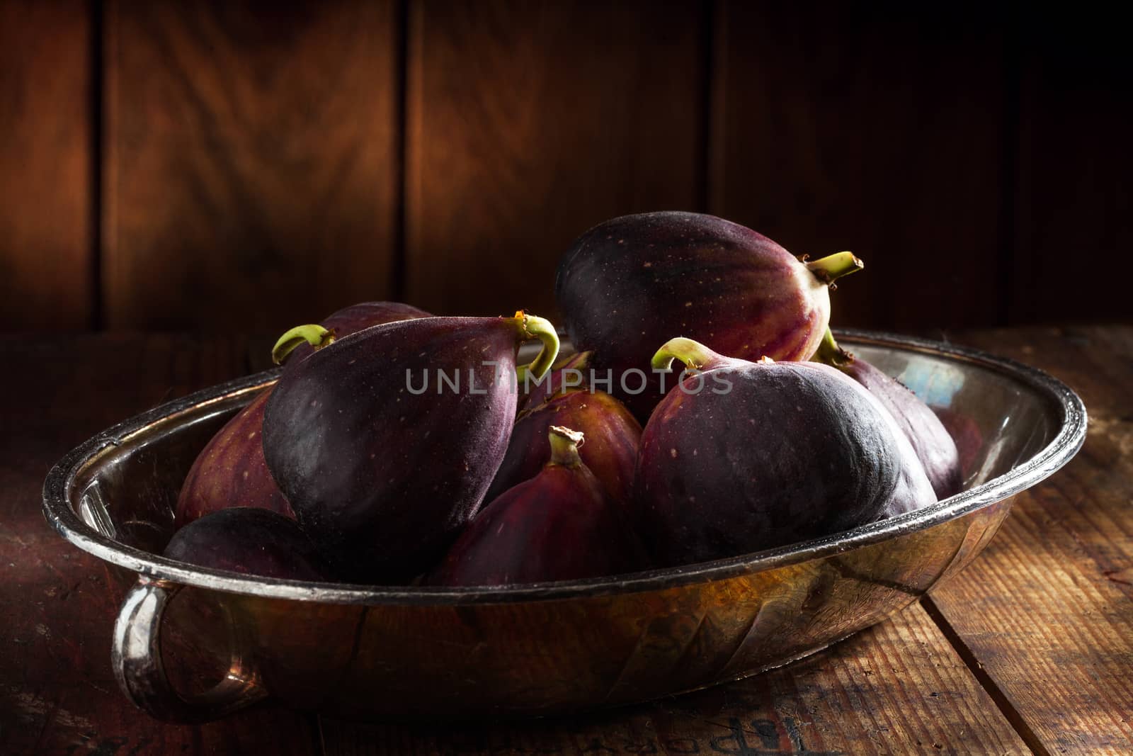 close up view of fresh figs on color back