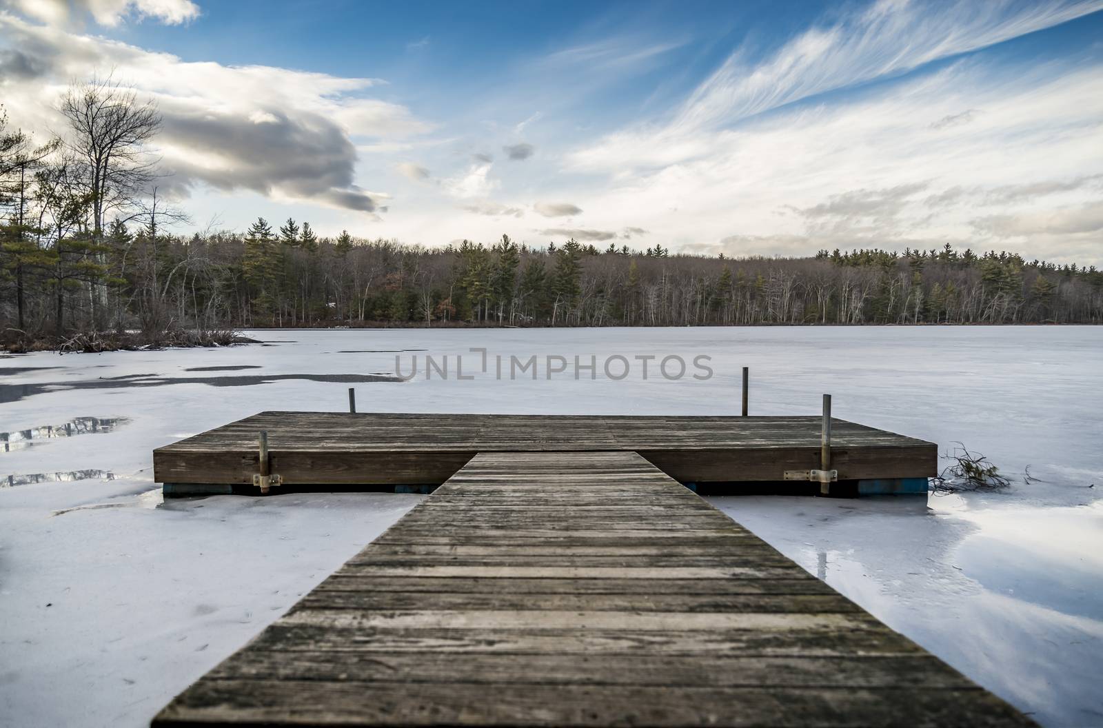 View of floating pier on a iced lake 