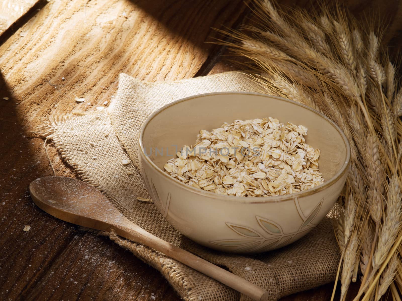 close up view of oat flakes on color back