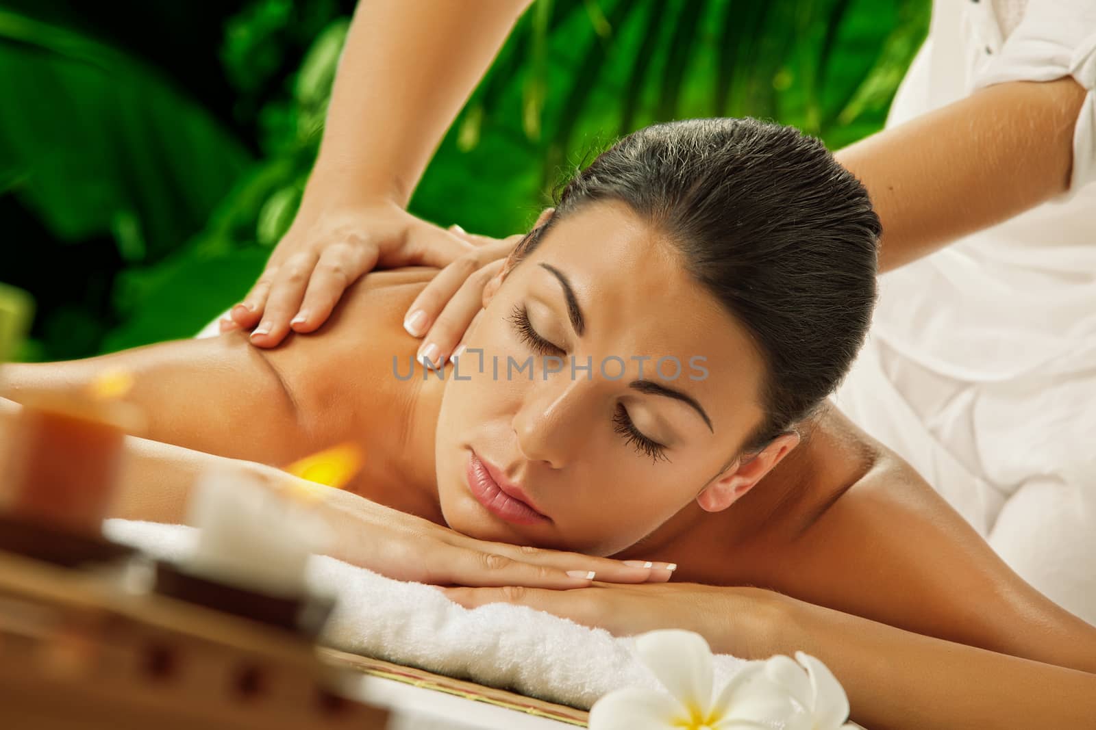 portrait of young beautiful woman in spa environment.