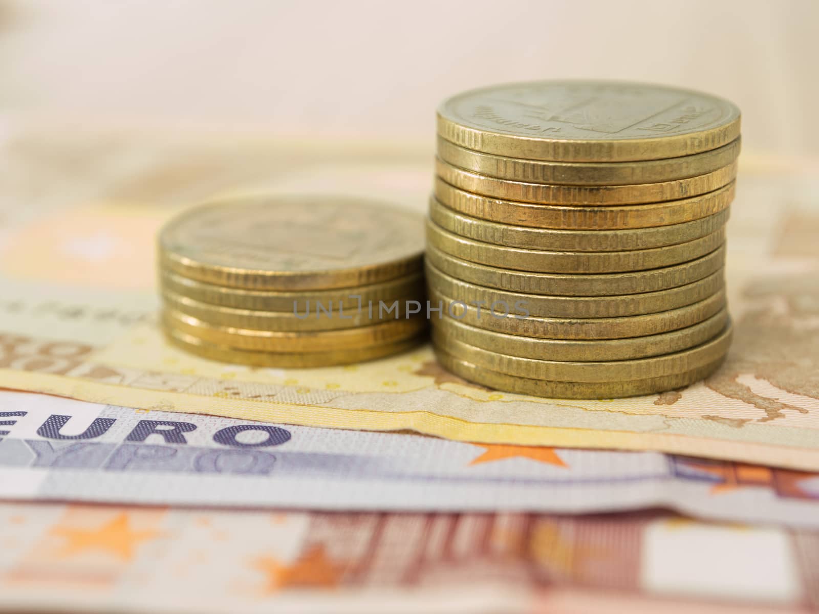 gold coin on euro banknote  background .  selective focus.