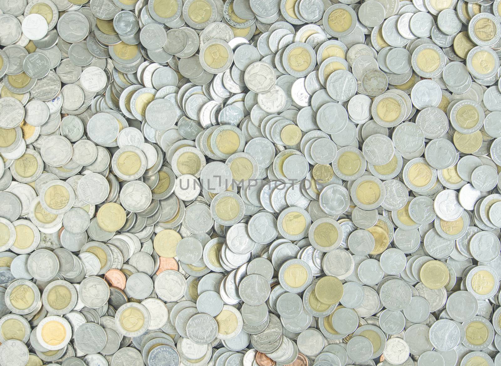Silver metal coins used to cover the background.