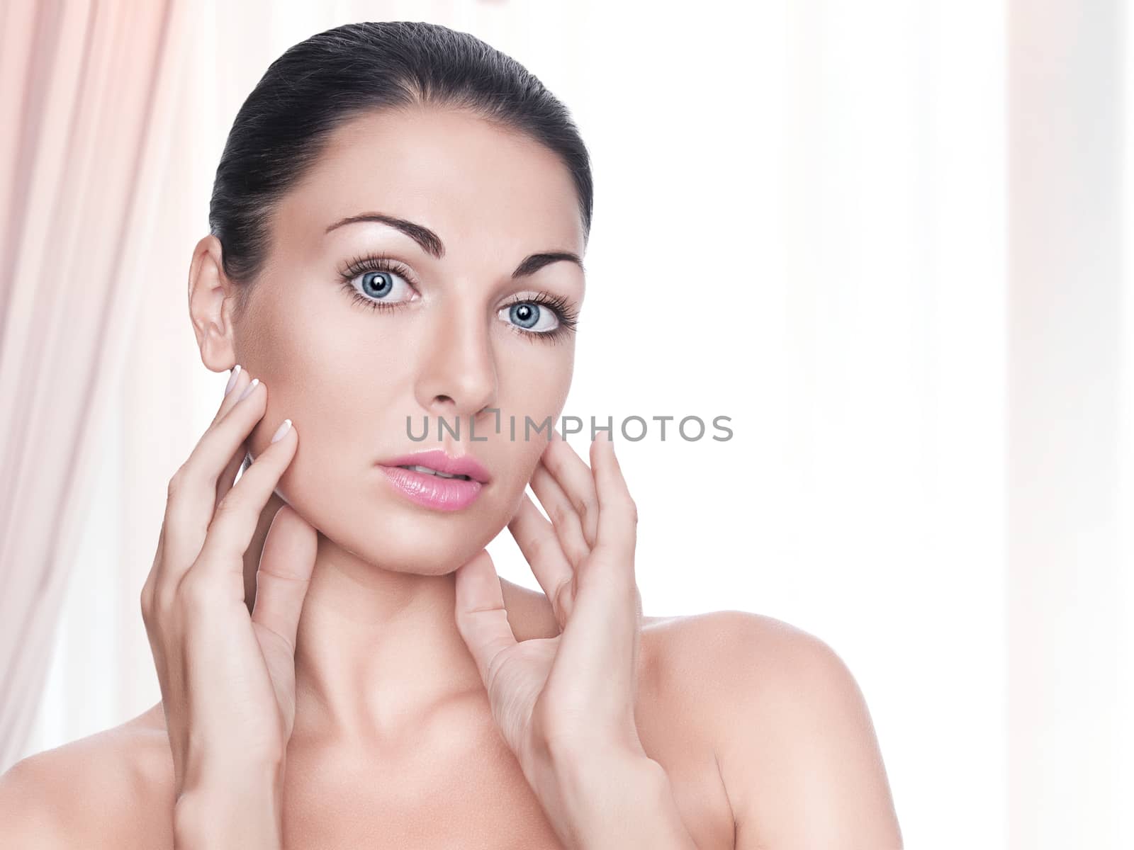 High key portrait of young beautiful woman  on pink back