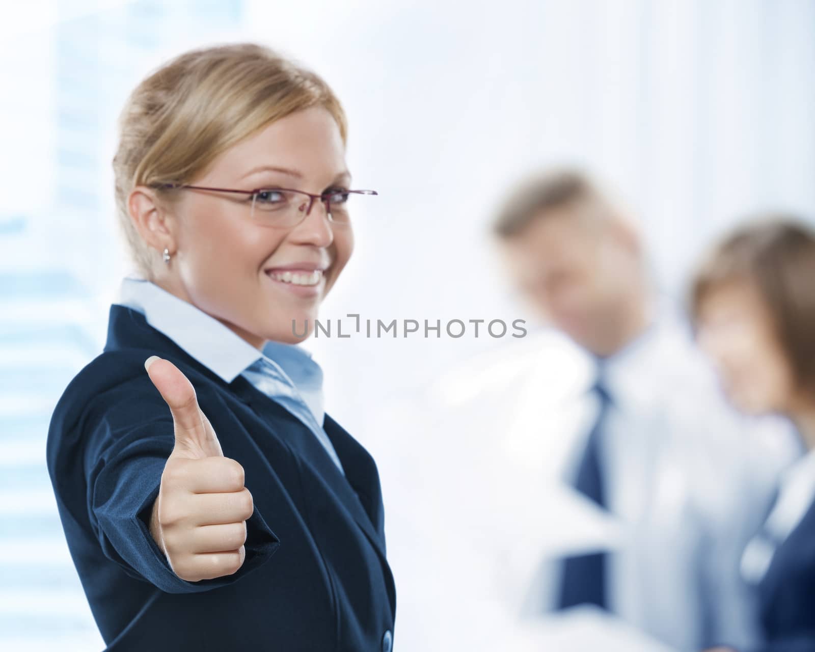 Portrait of young beautiful woman in office environment