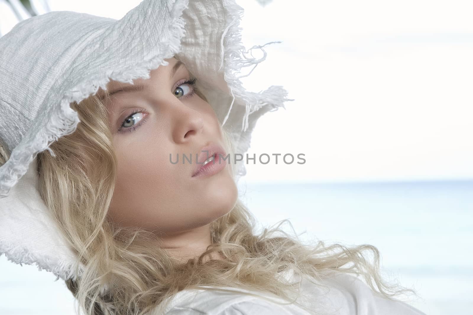 High key portrait of young beautiful woman  in summer environment